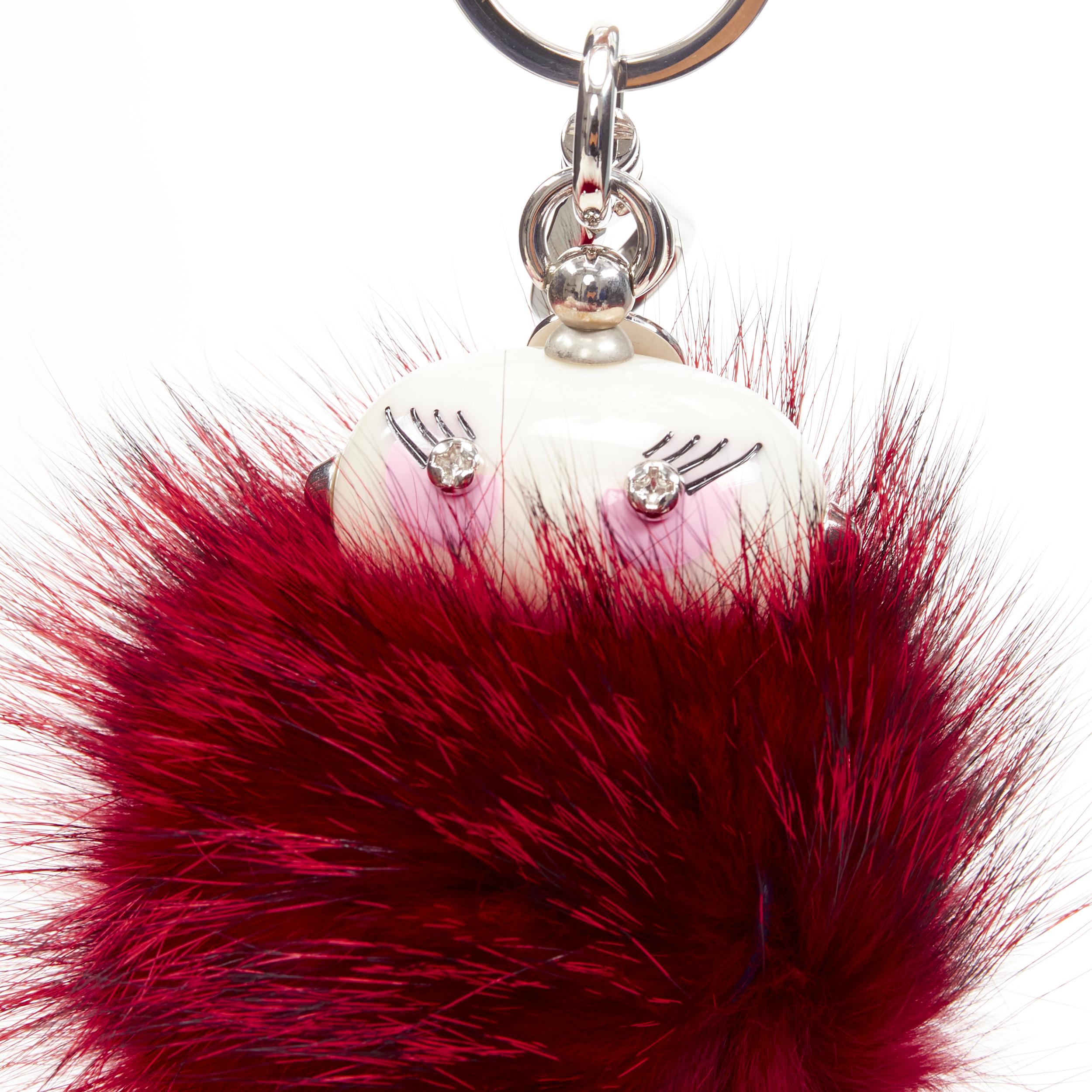 rare PRADA Robot red fur body mixed wire bolts keyring bag charm
Brand: Prada
Designer: Miuccia Prada
Collection: Robot 
Material: Mixed Materials
Color: Red
Pattern: Solid
Extra Detail: Silver-tone hardware. Oval head with screw embellished eyes.