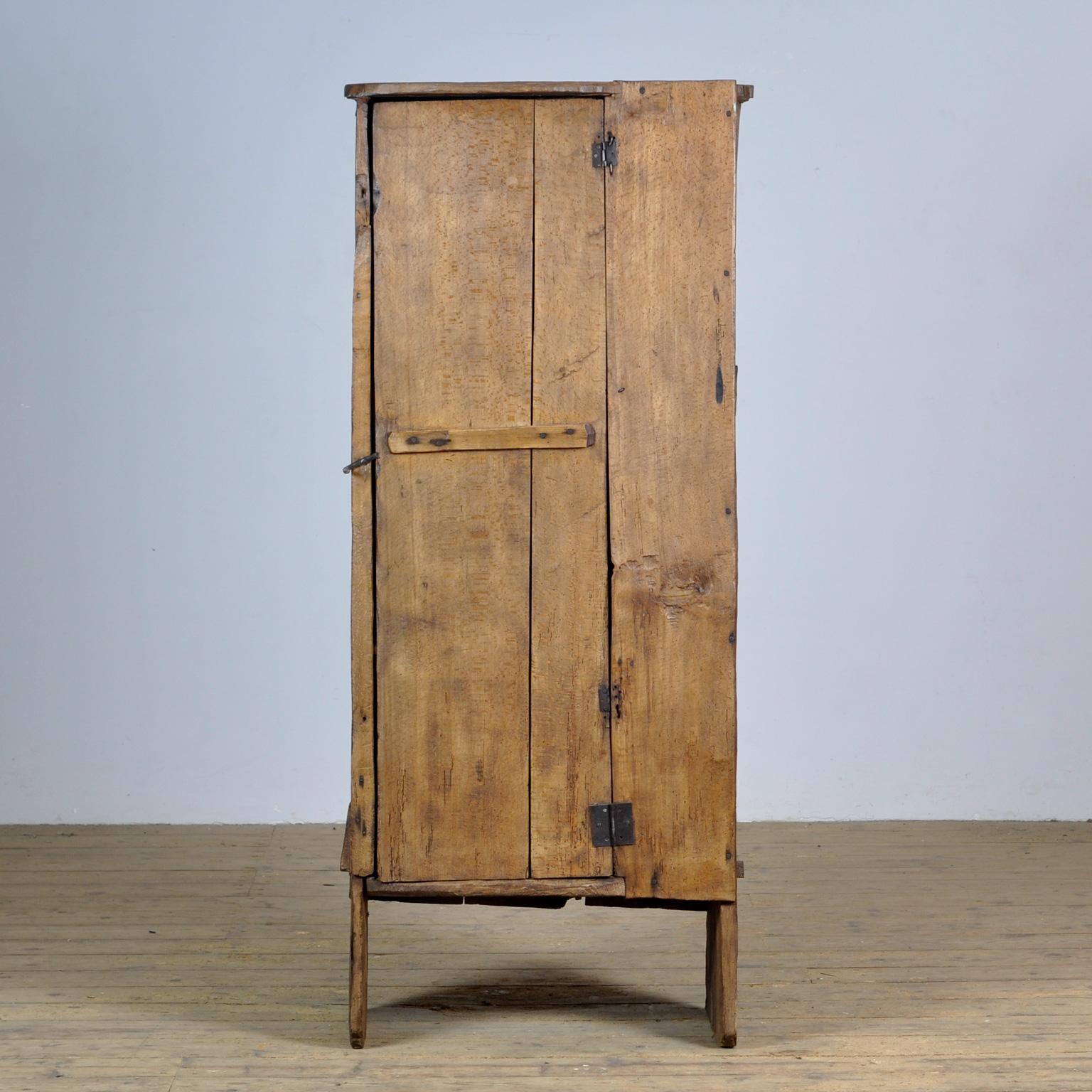 Rare primitive cupboard, Carpathians, 18th century, early construction, constructed from sawn or hewn beech wood. Two shelves on the inside. This is a cupboard from a very modest home in the highlands. It's a small miracle that this cupboard has
