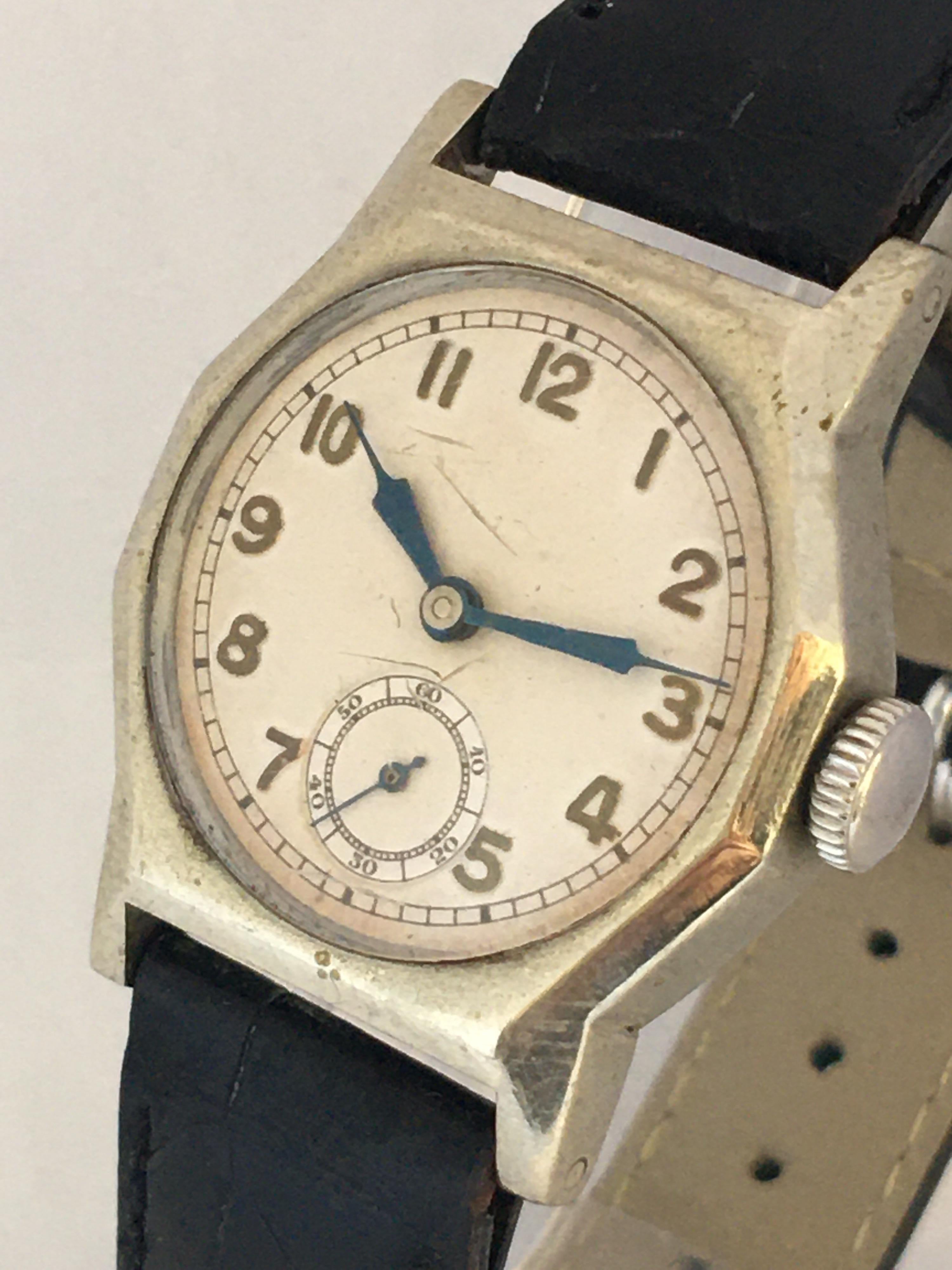 This beautiful pre-owned vintage hand-winding watch is working and it is ticking well and keeps a good time with its blue steeled hands and white dial. Visible signs of wear and ageing with some scratches on the glass and also on the watch case. It