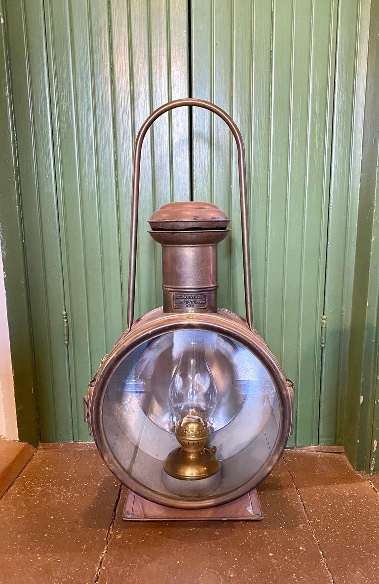 Rare Rail Road Locomotive Head Light, circa 1931. A large copper lantern with brass mountings and glass lens, with riveted label marked 