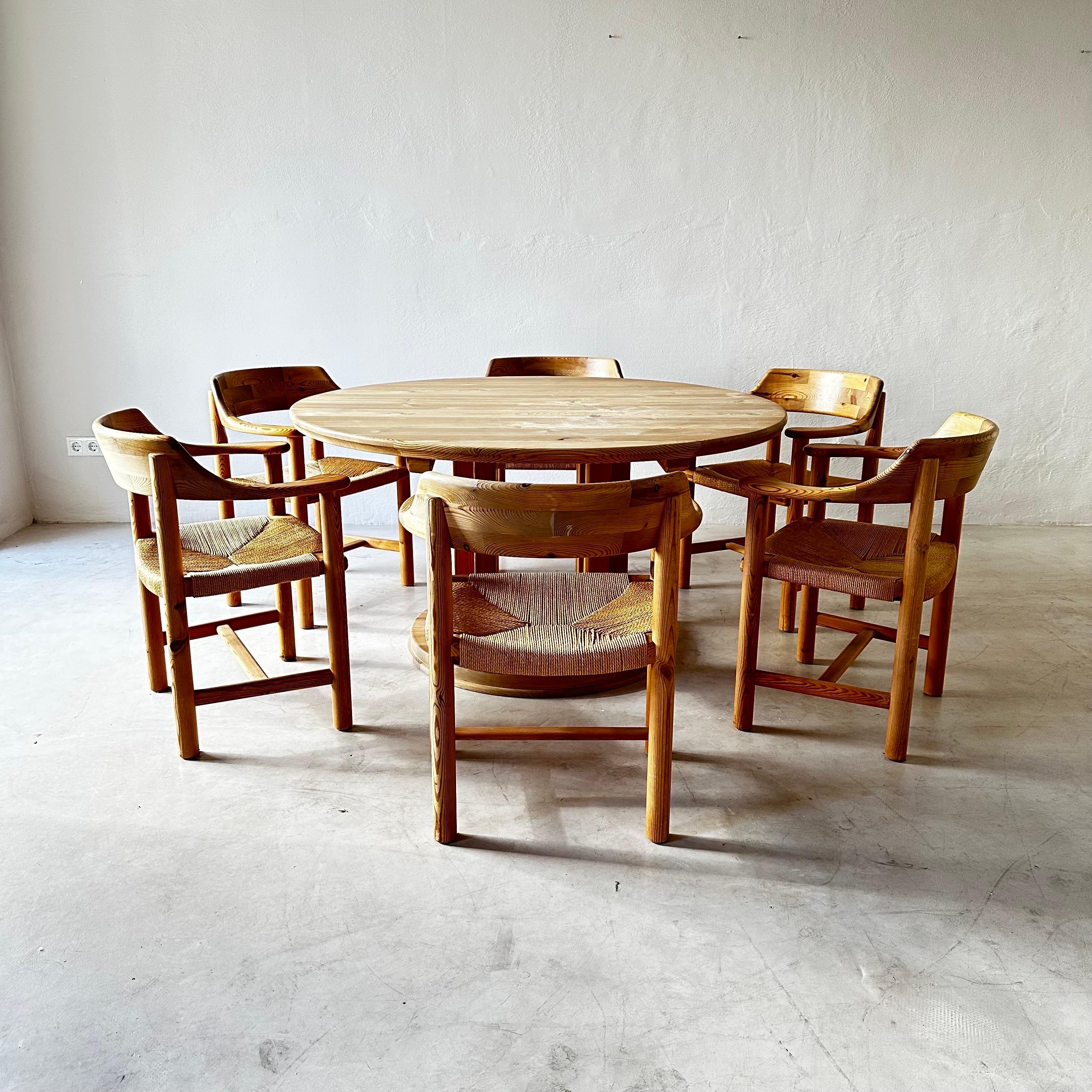 Rare Scandinavian-Modern rainer daumiller solid pine dining room set, Sweden 1970s.

This fantastic and very rare dining room set contains an oversized dining table and six dining chairs, designed by Rainer Daumiller. The tabletop rests on thick