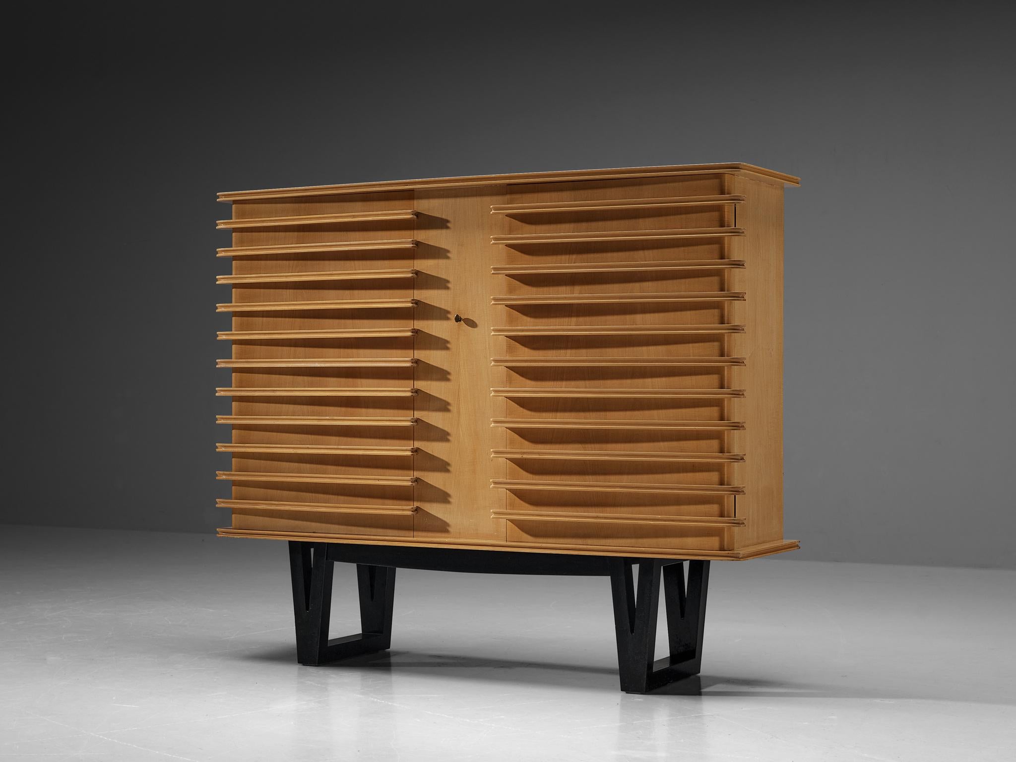 Raoul Clement and R. Verot, cabinet, varnished sycamore, dark stained wood, France, 1955

This rare cabinet is designed by French cabinetmaker Paul Clément et R. Verot and was presented at the 'Salon des arts household' in 1955. With regard to its