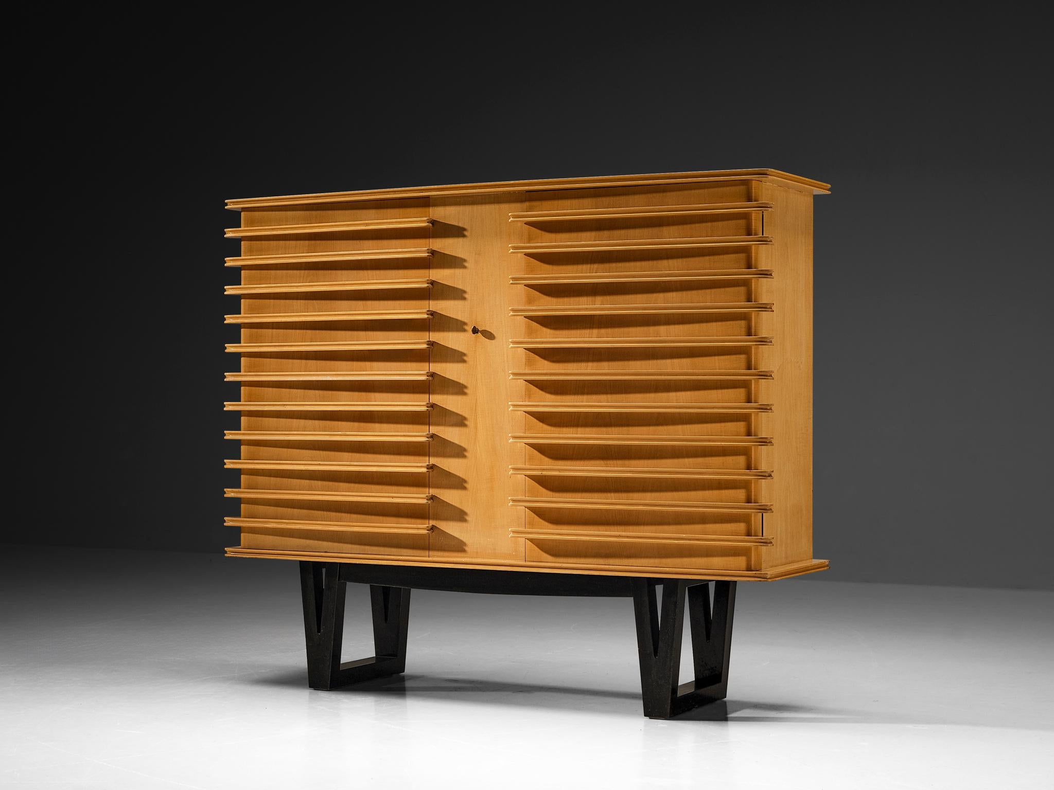 Raoul Clement and R. Verot, cabinet, varnished sycamore, dark stained wood, France, 1955

This rare cabinet is designed by French cabinetmaker Paul Clément et R. Verot and was presented at the 'Salon des arts household' in 1955. With regard to its