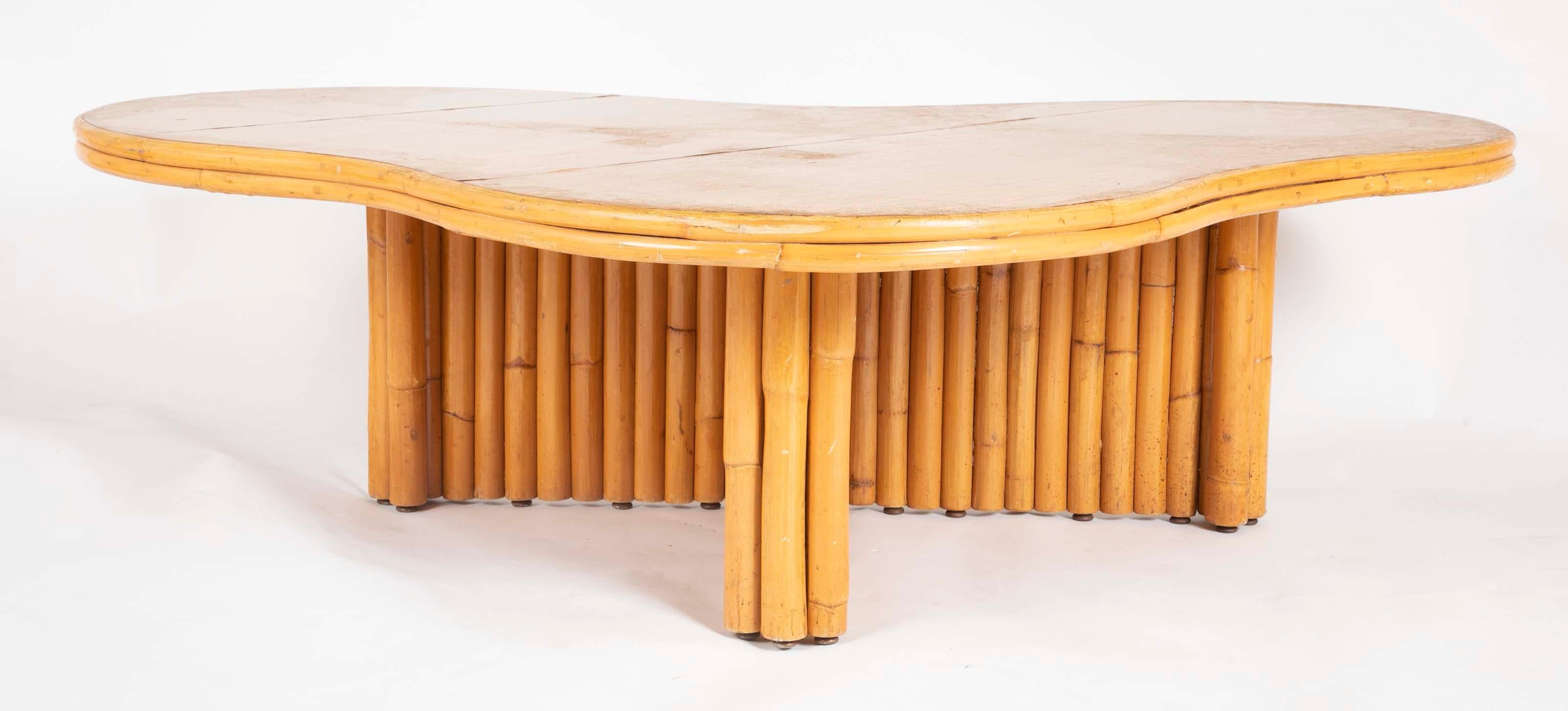 A beautiful rattan coffee table with removable top attributed to Paul Frankl. Interesting form. Very rare.