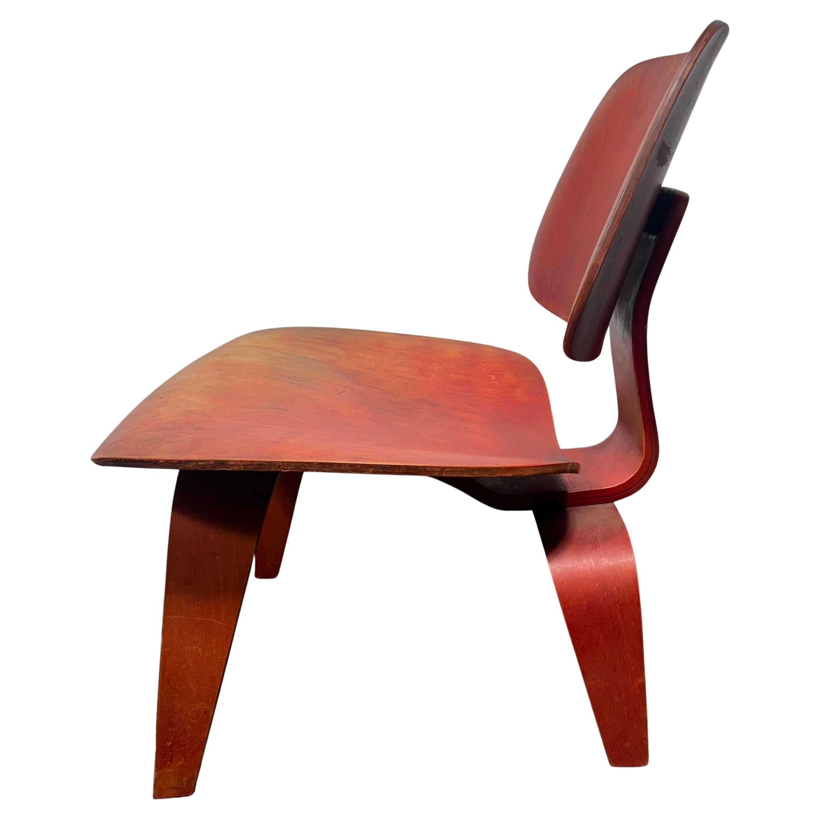 Rara A.L.C. rossa (sedia da salotto in legno) Charles Eames / Evans