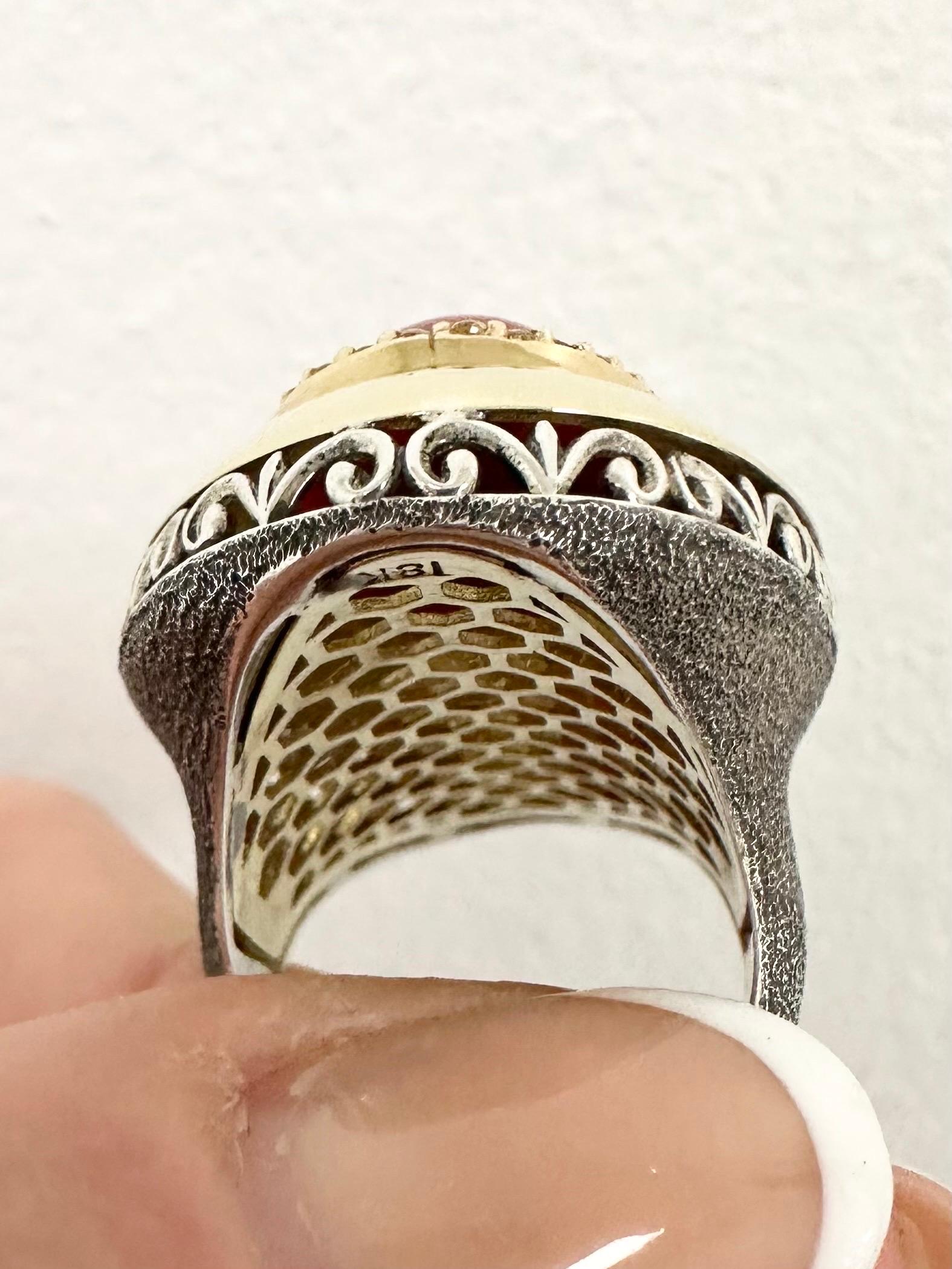 Exquisite ring made with natural red coral(undyed 100% natural and certified) diamond halo and 18KT yellow gold as well as silver pieces. Very complex design and a lot of handwork details in this ring. Designer unknown but probability is Italian