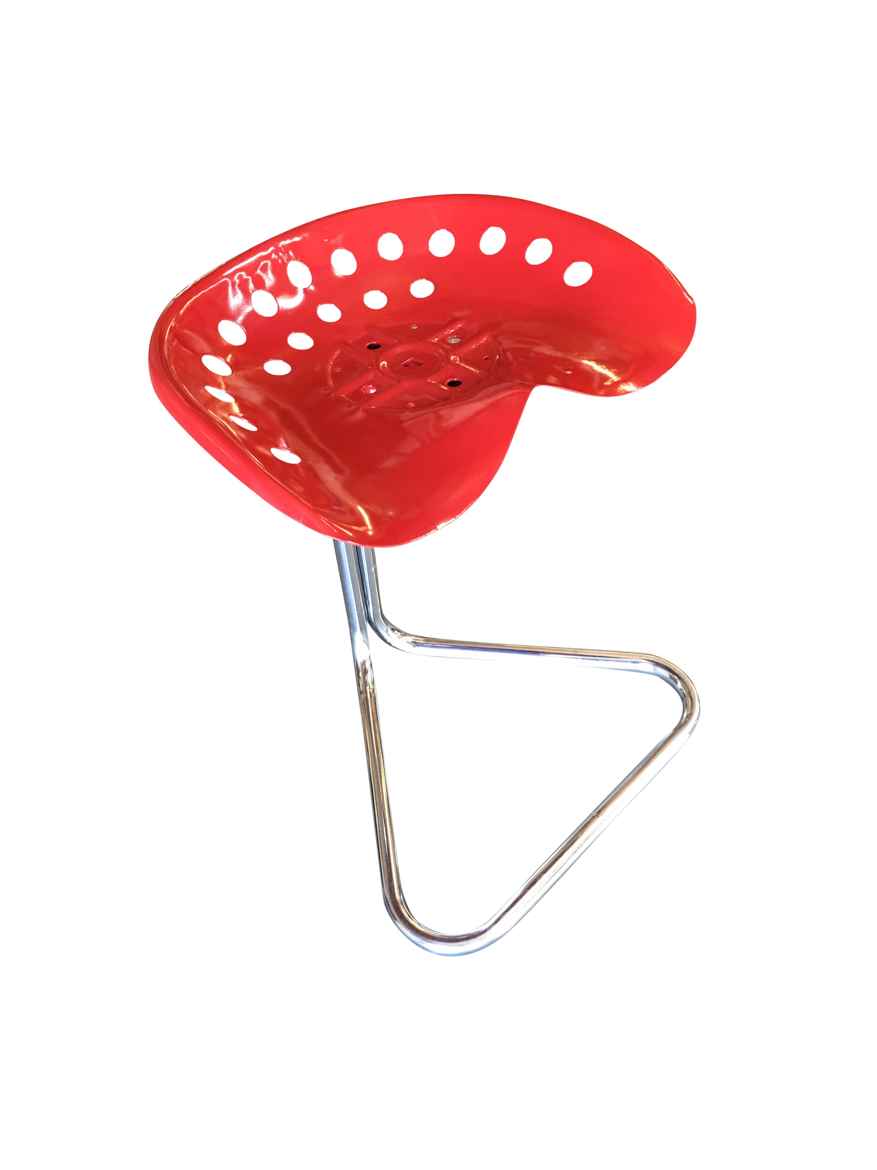 Designed by British designer Rodney Kinsman for his company OMK in 1971, these rare red edition T7 Tractor Stools features a seat made from an actual tractor seat mold. The seat is fixed to a cantilevered base of one inch chrome plated tubular