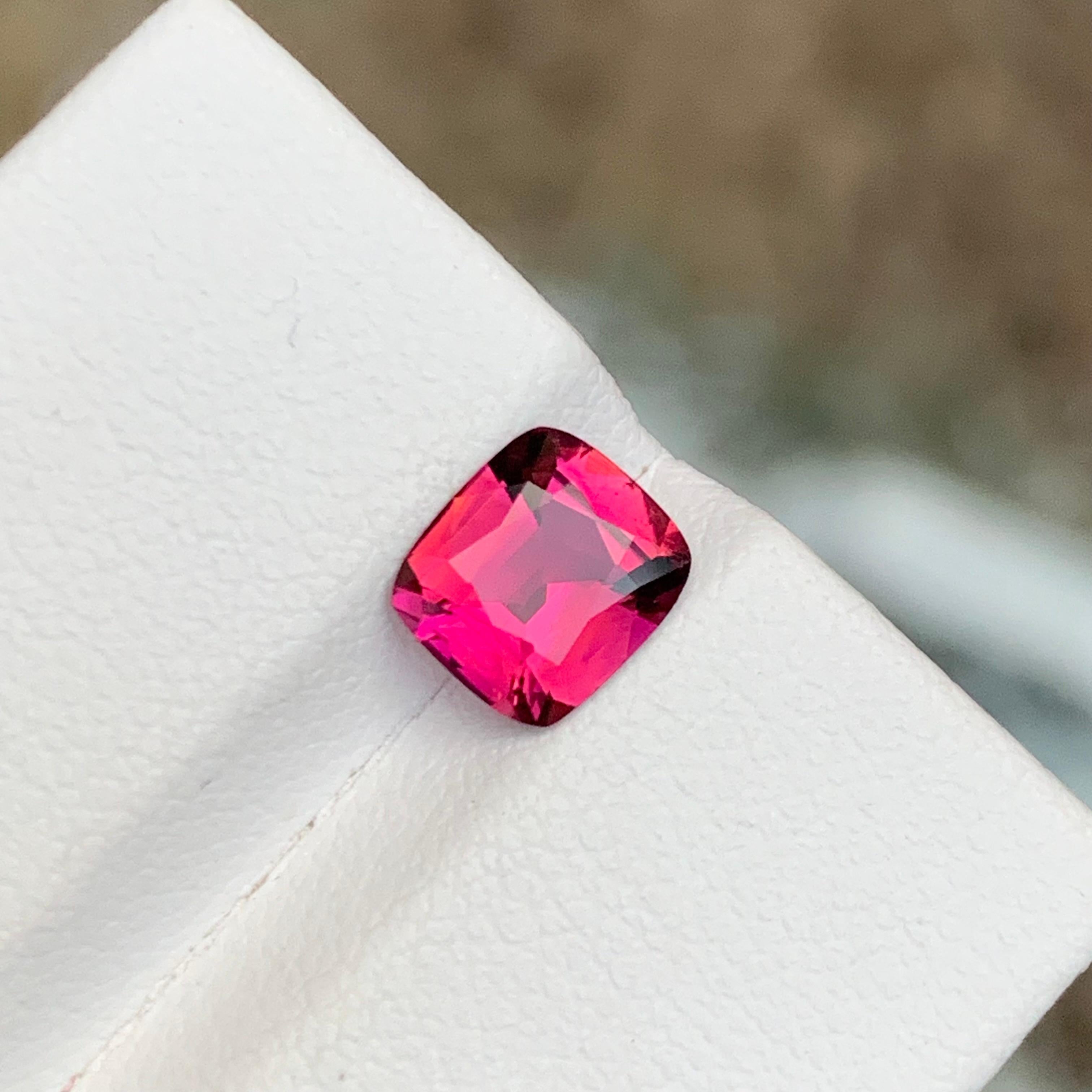GEMSTONE TYPE: Rubellite Tourmaline
PIECE(S): 1
WEIGHT: 1.20 Carats
SHAPE: Cushion 
SIZE (MM): 7.15 x 6.37 x 3.76
COLOR: Reddish Pink 
CLARITY: Eye Clean
TREATMENT: Heated
ORIGIN: Afghanistan
CERTIFICATE: On demand

Introducing our exquisite 1.20