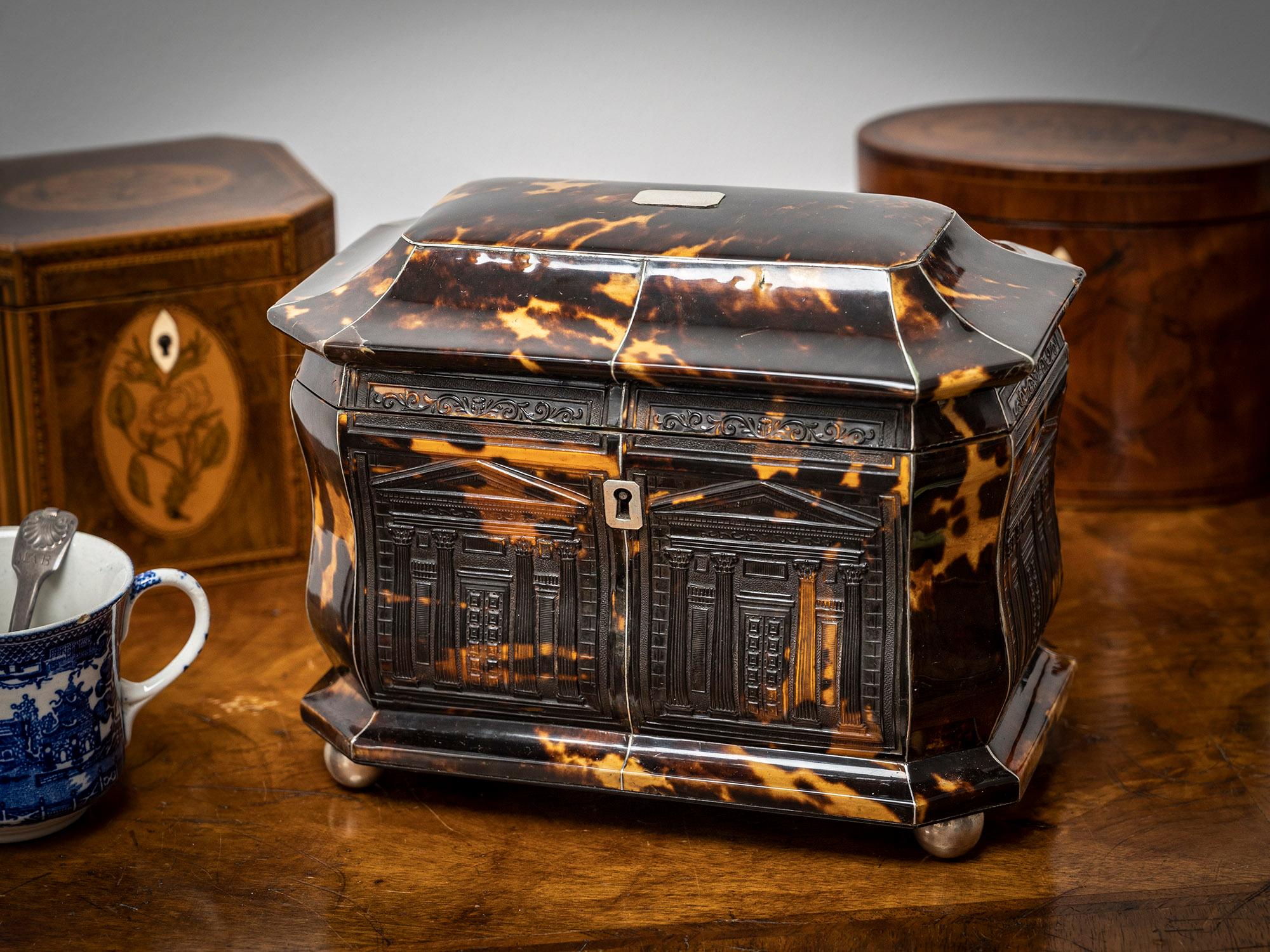 Pressed Tortoiseshell Design

From our Tea Caddy collection, we are delighted to offer this Regency Architectural Tortoiseshell Tea Caddy. The Tea Caddy of bombe form with flared base, canted corners and pagoda top finished with silver stringing and