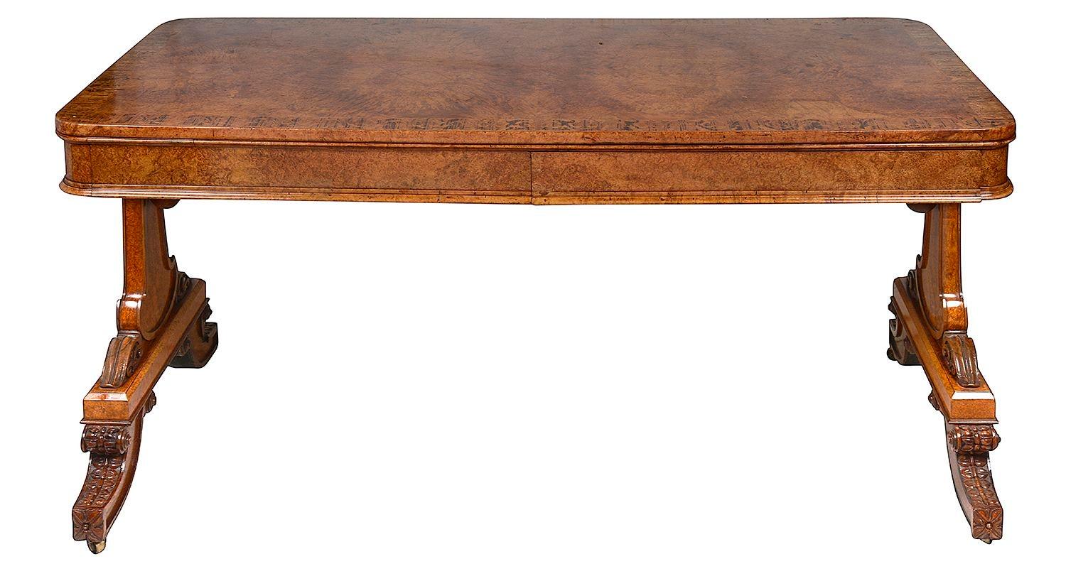 A rare and fine quality Regency period end support Library table, veneered in this wonderful figured Amboyna with Rosewood crossbanding, two frieze drawers, supported on elegant end supports with hand carved classical decoration.
 
Batch 69 562661.