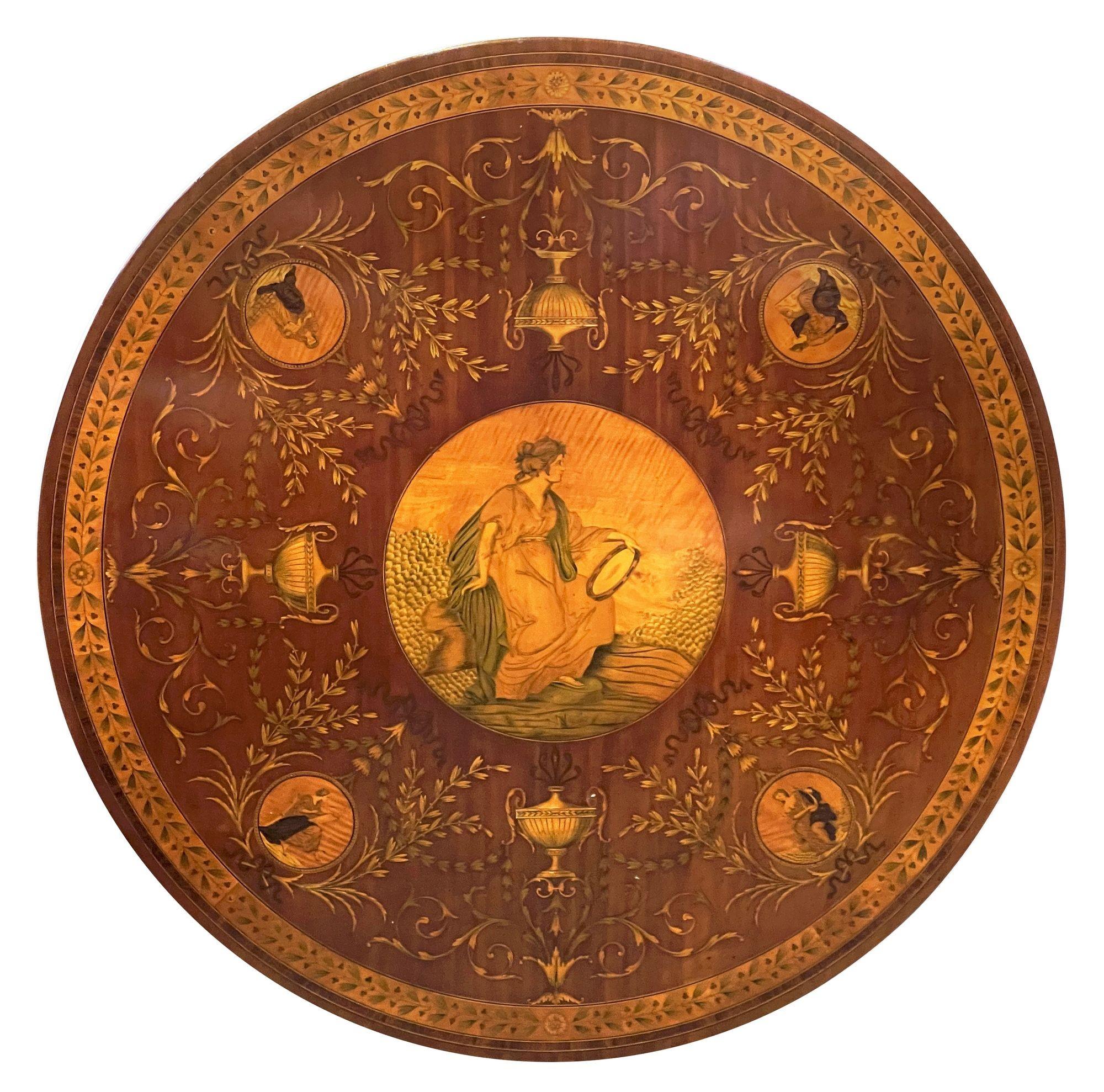 A fine quality Regency period Mahogany centre table with Satinwood cross banding and wonderful marquetry inlaid decoration to the centre. Depicting seated classical female figures playing various musical instruments, four classical urns united by