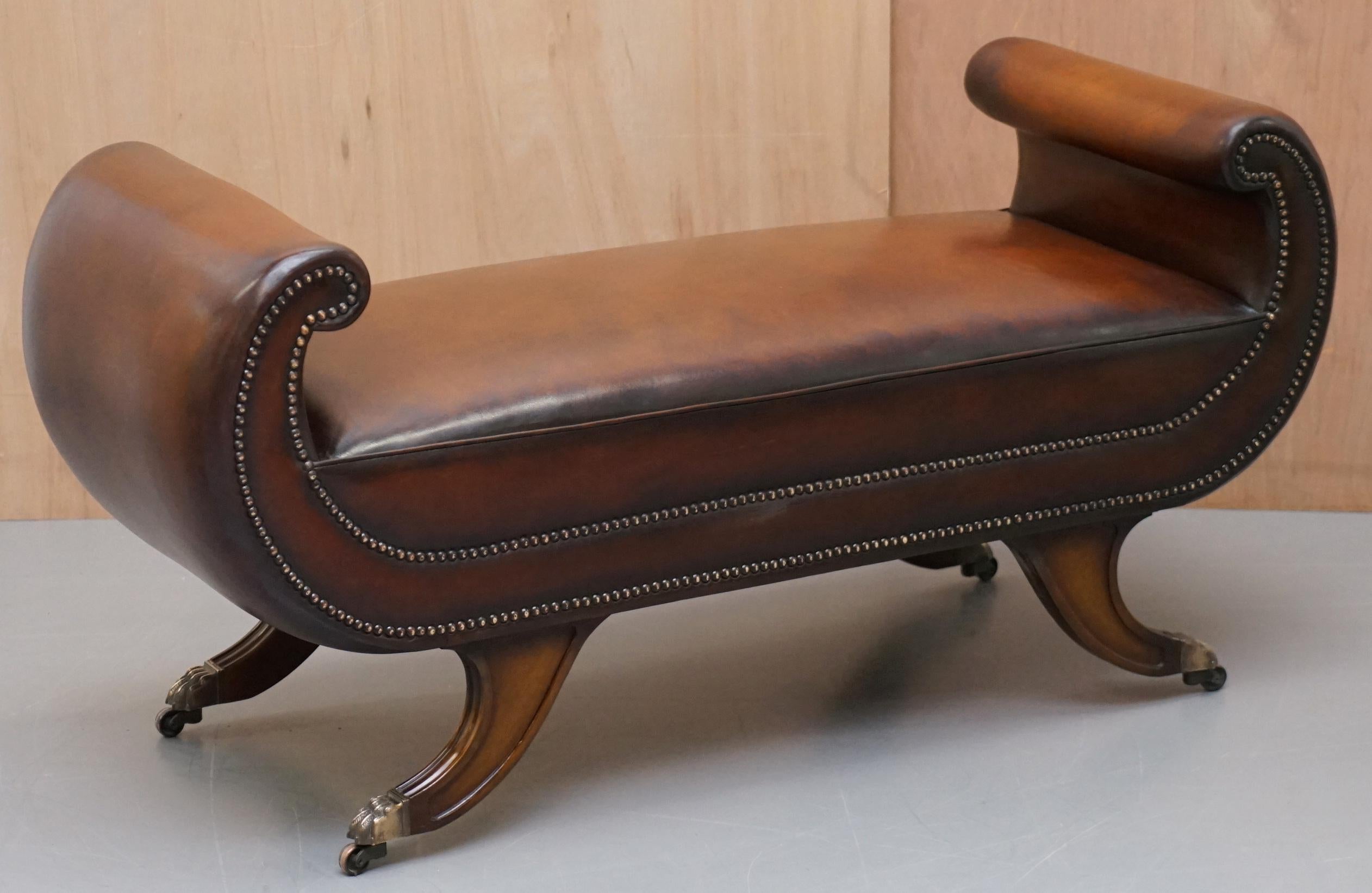 We are delighted to offer for sale this absolutely stunning fully restored Regency style scroll arm window seat in hand dyed cigar brown leather

This bench has been fully restored to include being washed back, it has then been hand dyed this