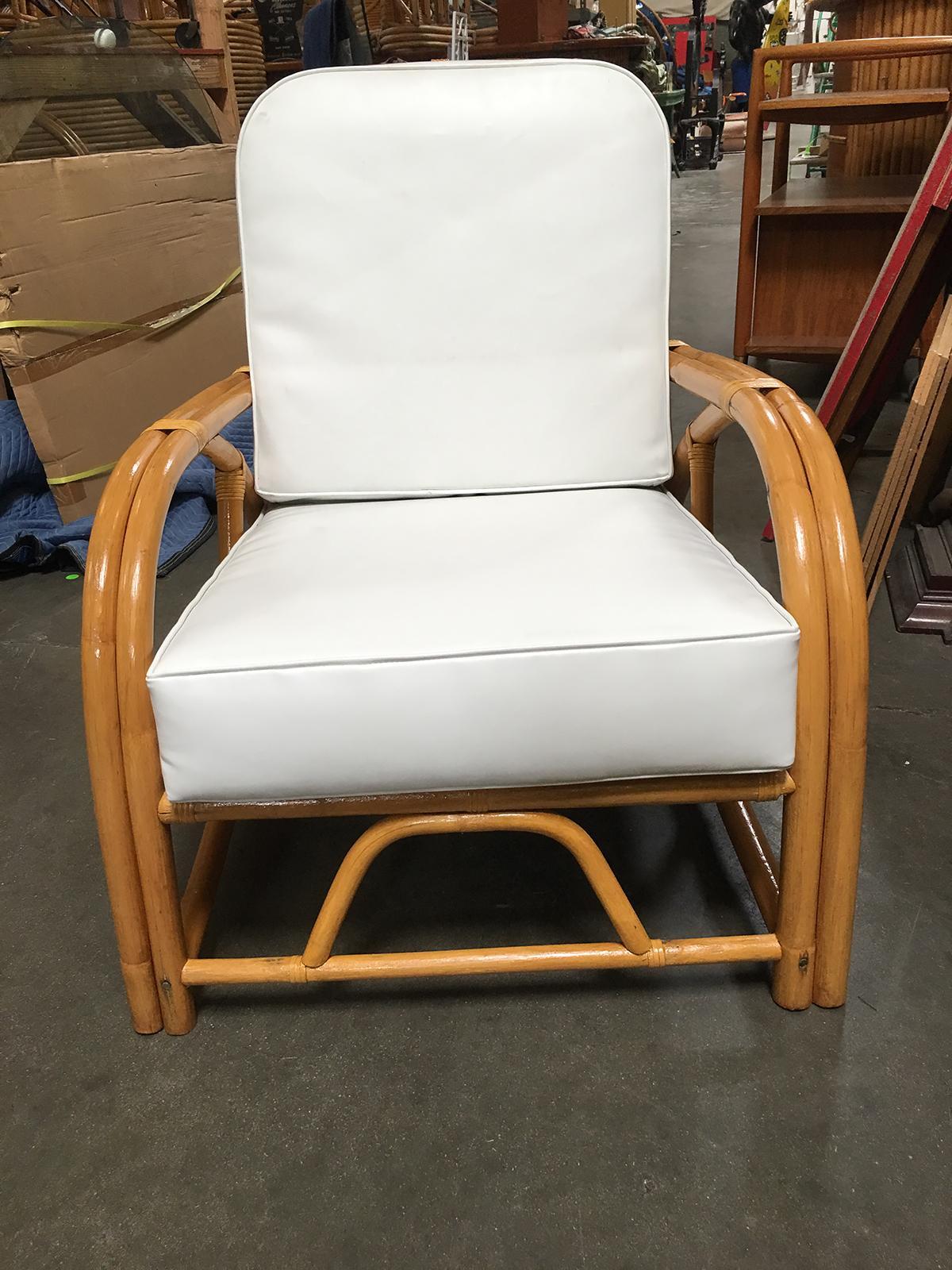This rare rattan reclining lounge chair with arched 1949 arms. Custom cushions C.O.M. (Costumers Own Material) are included in the price. Simply supply the fabric and we have the cushions made for you. If you need help sourcing fabric we can help!