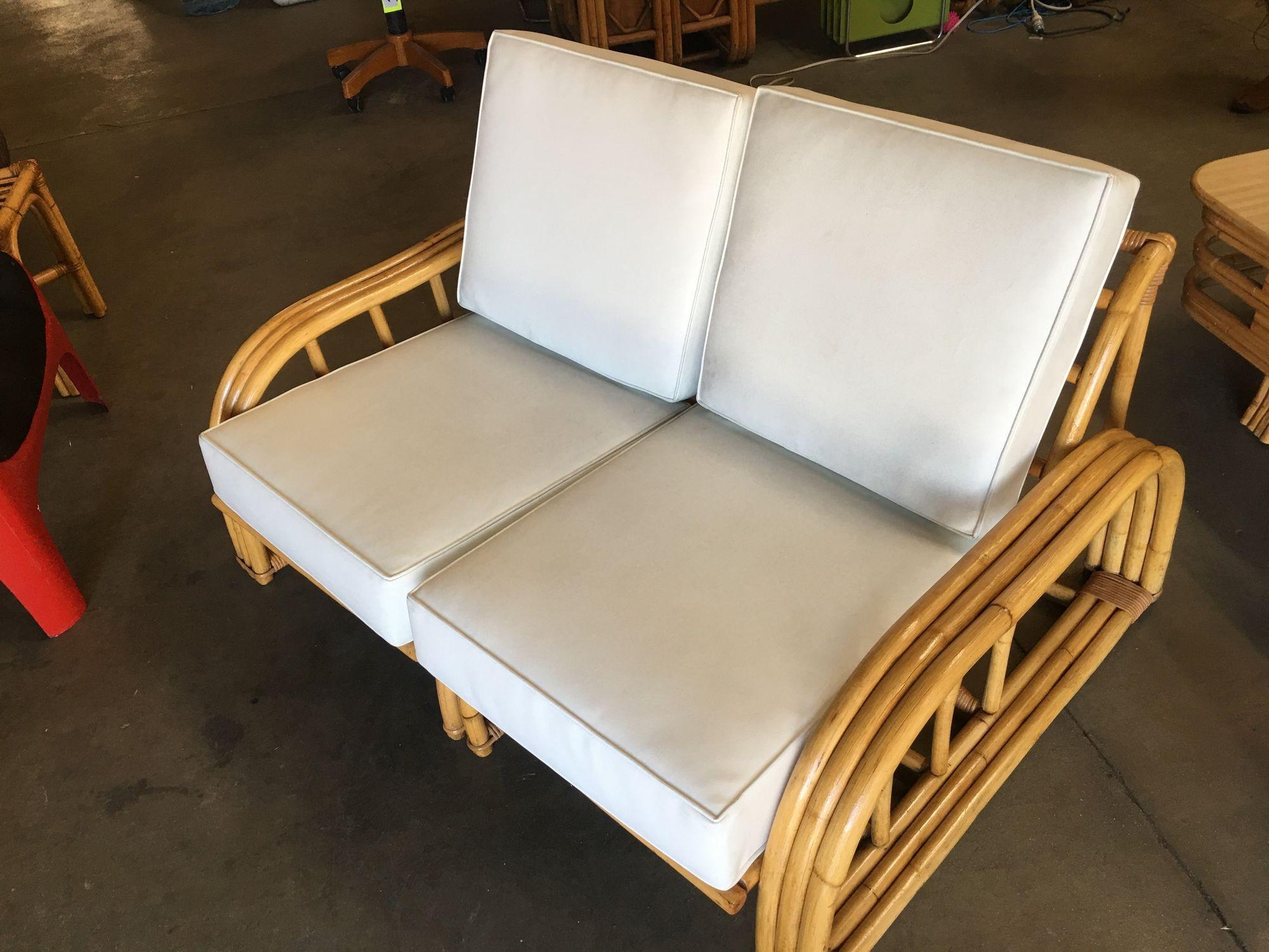Rare museum quality Paul Laszlo three-strand rattan settee. This loveseat dates from 1941 and features a unique arched arm and lounge arched seat back.

1950, United States

We only purchase and sell only the best and finest rattan furniture made by