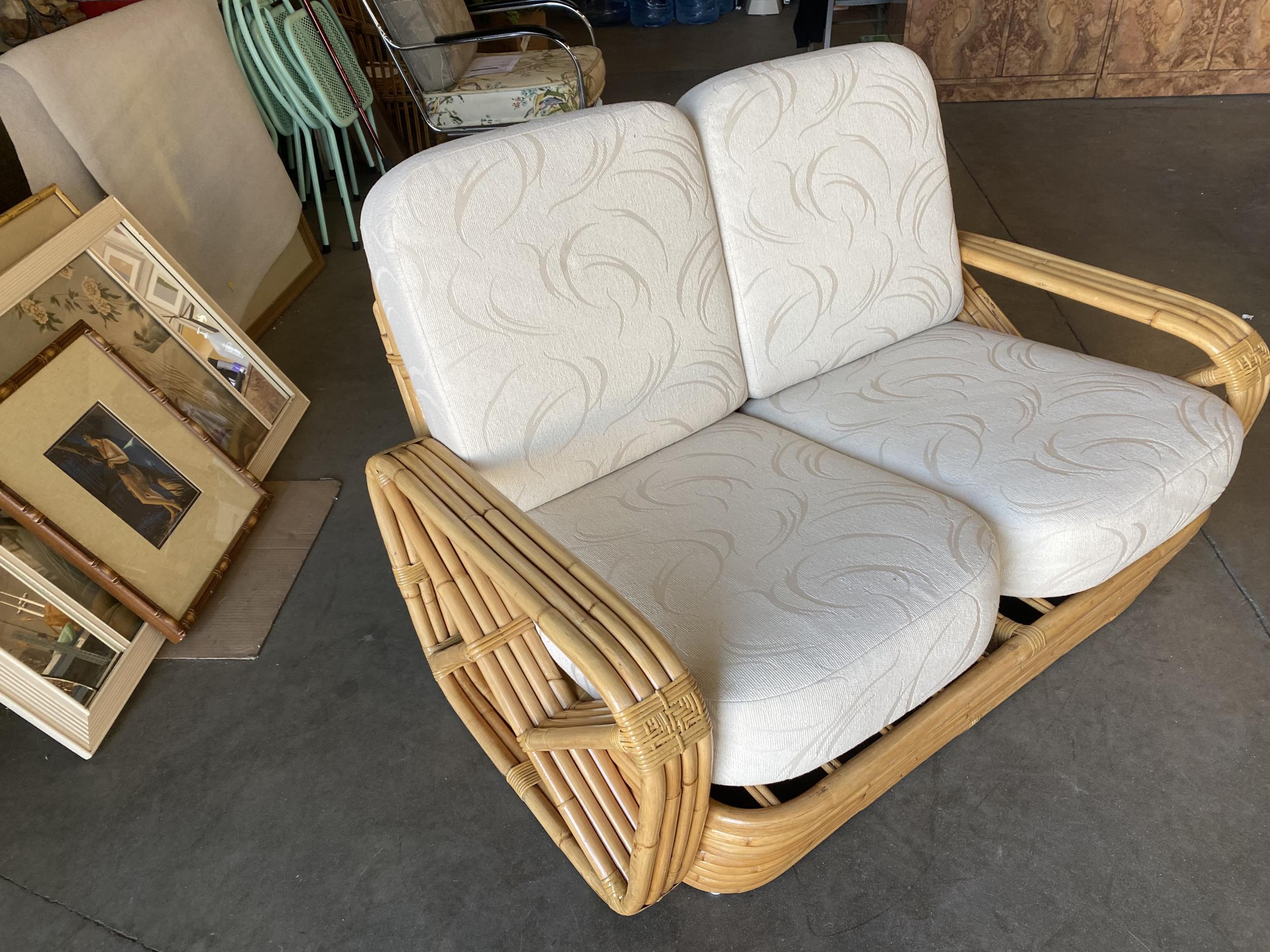 Paul Frankl four-strand square pretzel rattan arm settee. This loveseat settee dates from 1934. This comes directly from a Paul Frankl decorated house located in Los Angeles and is documented. 

Custom cushions C.O.M. (Costumer's Own Material) are