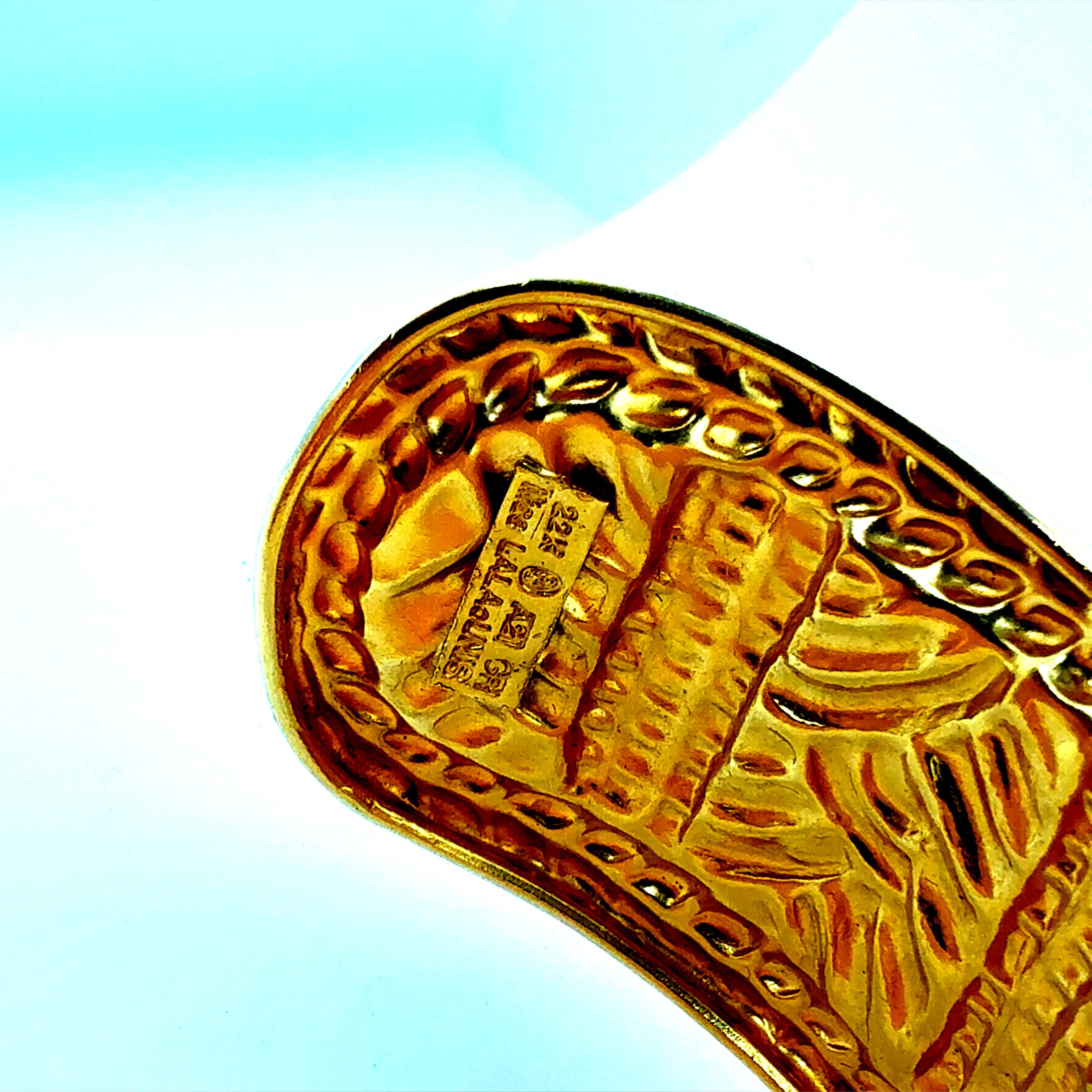 Rare retro 22K yellow gold cuff bracelet by Ilias Lalaounis, celebrated for his sculptural Greek designs and exceptional goldsmithing. The bracelet measures approximately 1.25 inches in width and 6 inches along the inner rim, or about 7 inches