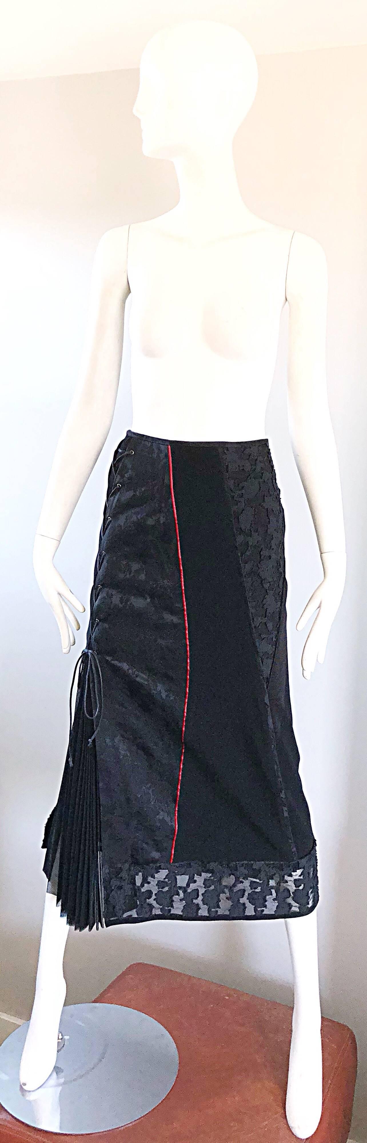 Super rare early 90s RITSUKO SHIRAHAMA black mixed media midi skirt! Features lace, tulle, silk, wool, nylon, rayon and cotton fabrics throughout. Laces up the right side, with hidden zipper up the back and hook-and-eye closure. Accordian pleated