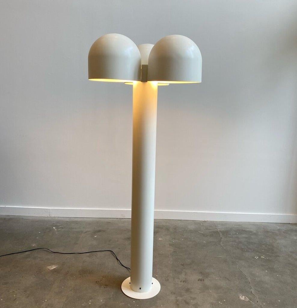 A rare Robert Sonneman post-modern floor lamp recently refurbished by The Somerset House. This light gives off a radiant and warm glow created by the three sculpted metal shades. The finish was originally chrome updated to a professionally