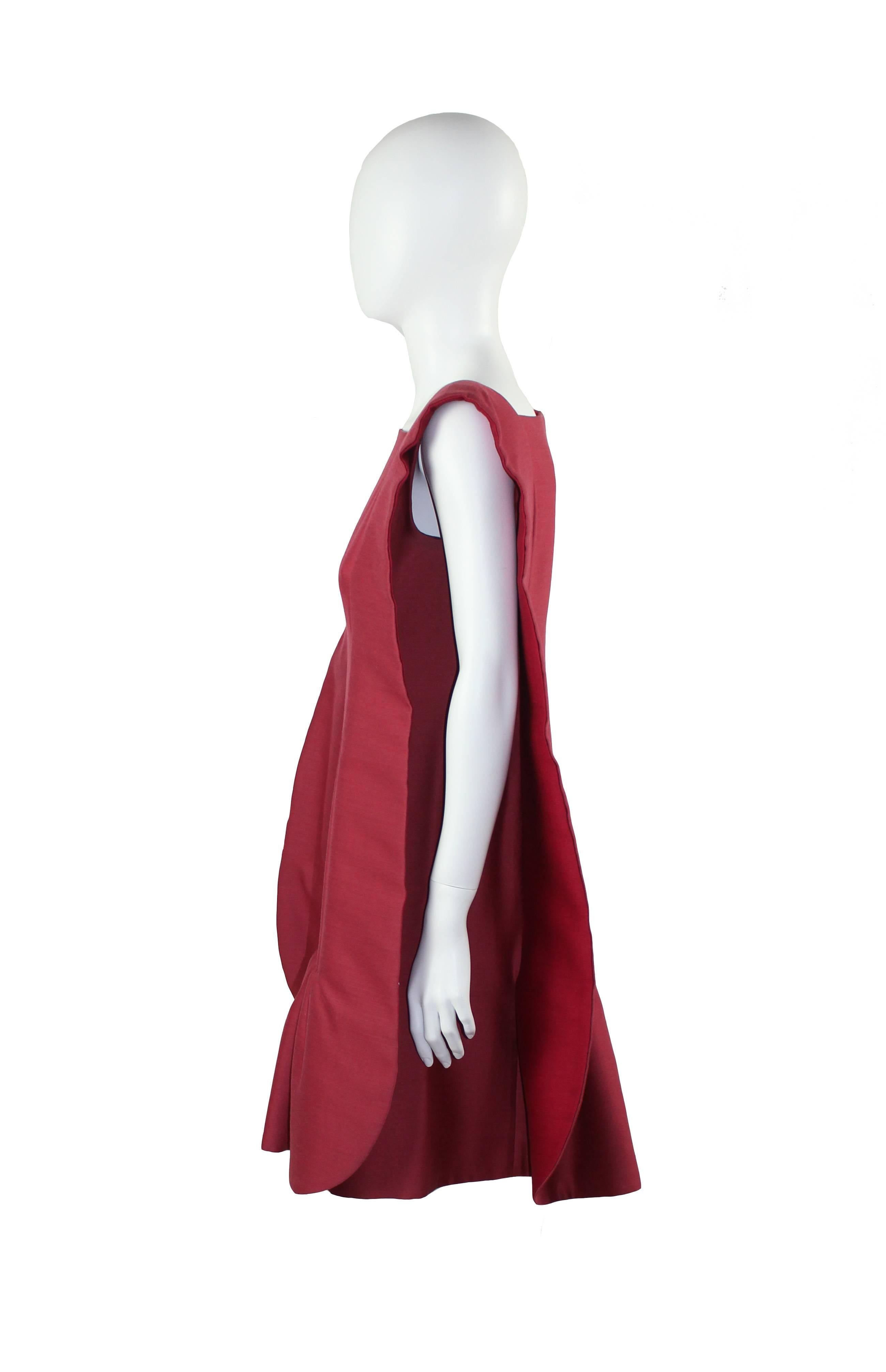 Rare Roberto Capucci couture raspberry pink wool/silk fabric dress, sculptured side panels. Hidden side zip.
Mid 80s.
Bust: 92 cm
Perfect condition
