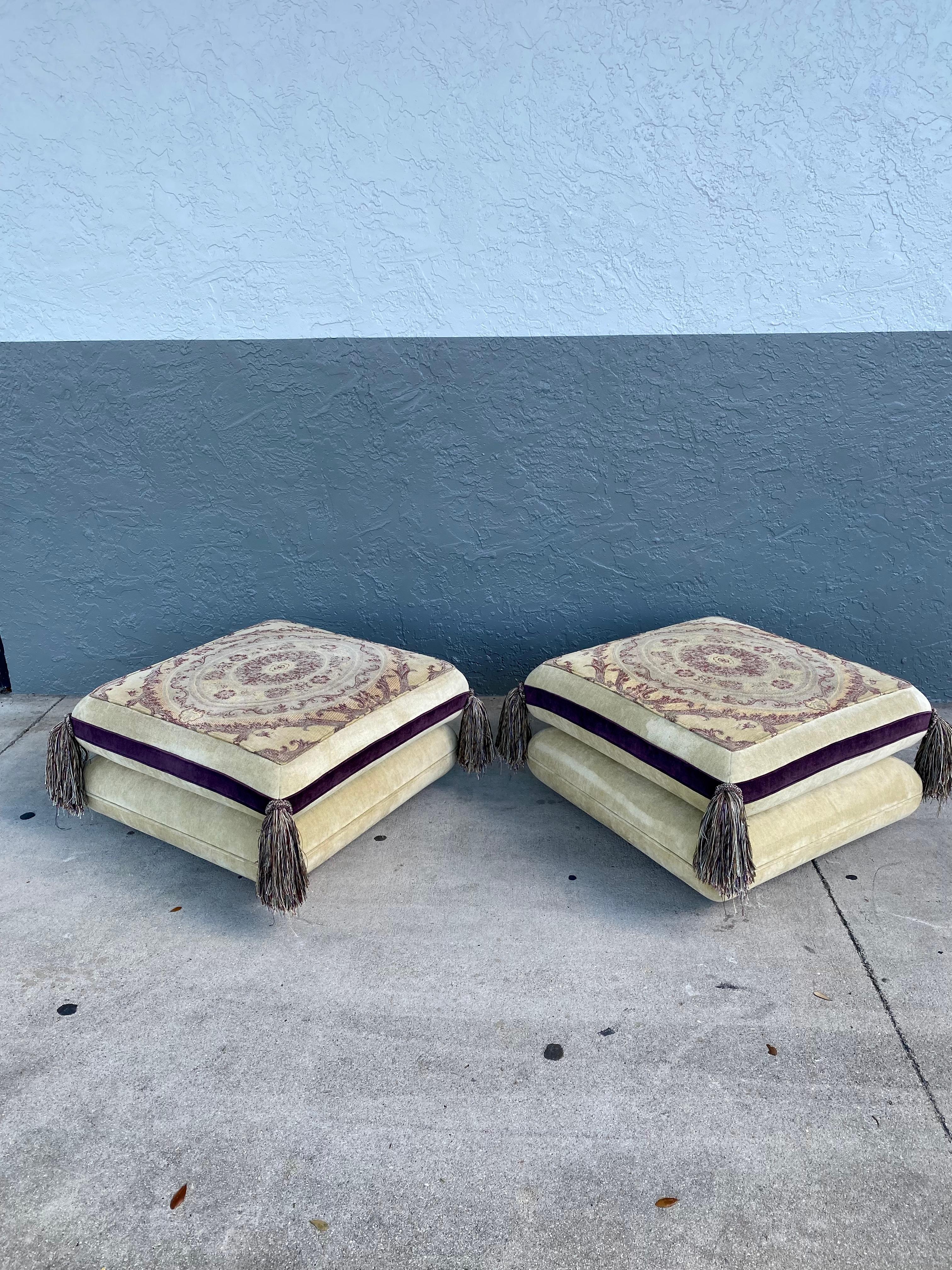 These extremely rare mid century and stylish original upholstered ottomans are packed with personality! Outstanding design is exhibited throughout.. Their beautiful and square shape ottomans feature a comfortable design. The pieces are so stunning