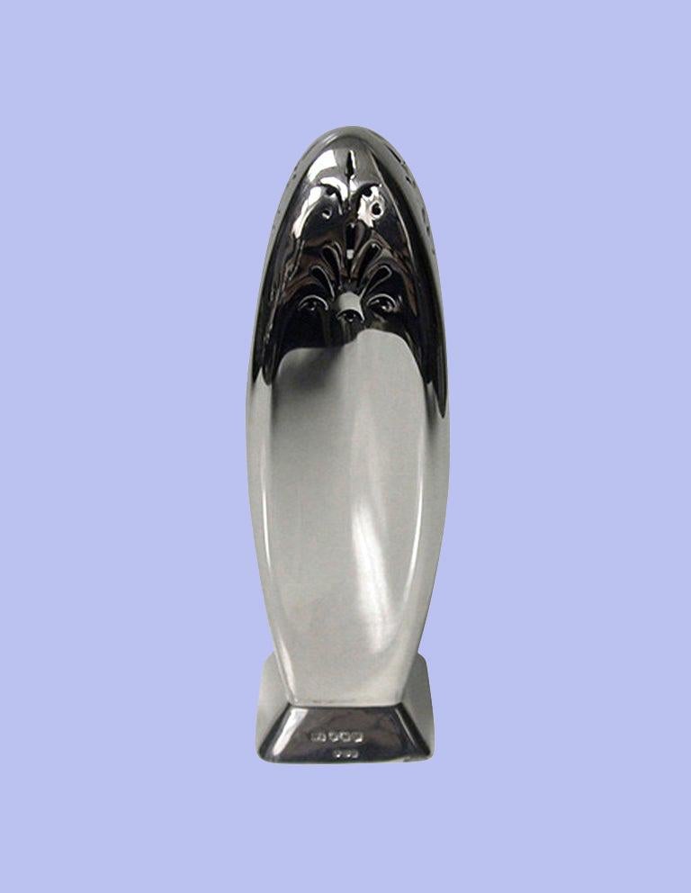 Rare rocket shape silver caster, import marks Dublin 1941, hallmarked for Sheffield 1939, Atkins Bros. The Caster of ergonomic rocket shape, plain with pierced upper rounded parabolic 'nose' cone top; plain quadrilateral base, silver hallmarked