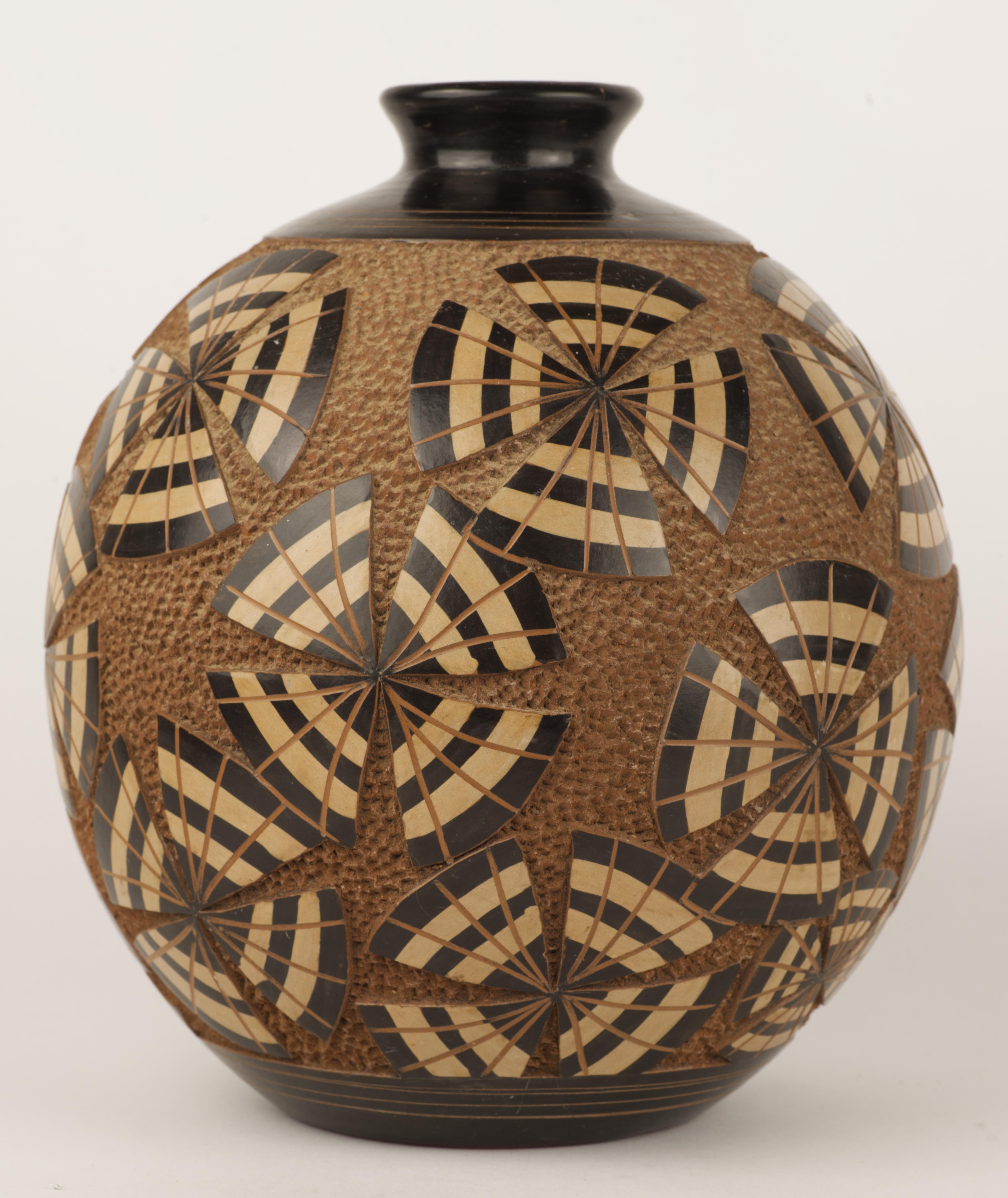  Unusual round ceramic vase is decorated with carved abstract repeating geometric design. Minimal shape and reserved, earthy dark caramel and chocolate brown palette lets hand carved, highly detailed, richly textured pattern to take center stage.