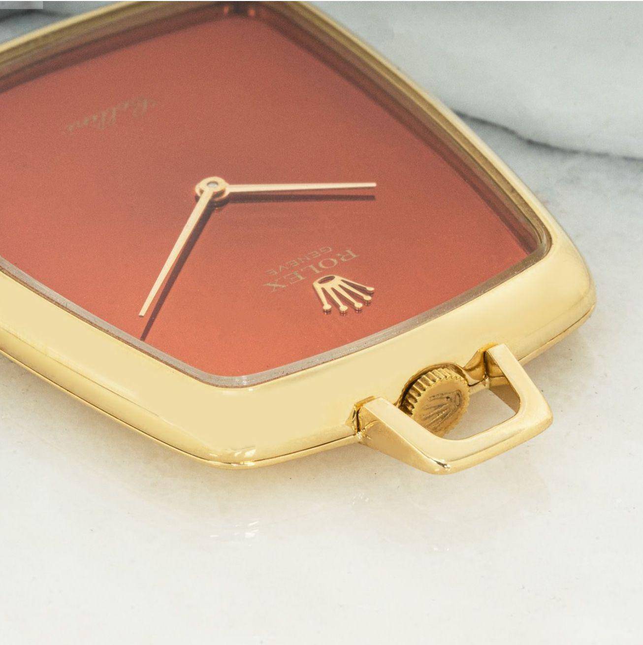 Rolex Cellini. A Rare Coral Coloured Dial,18ct Yellow Gold Keyless Lever Dress Open Face Pocket Watch C1970.

Dial: The Coral coloured dial fully signed Rolex Geneve and signed Cellini at six o'clock with gold pointer hands.

Case: The 18ct yellow