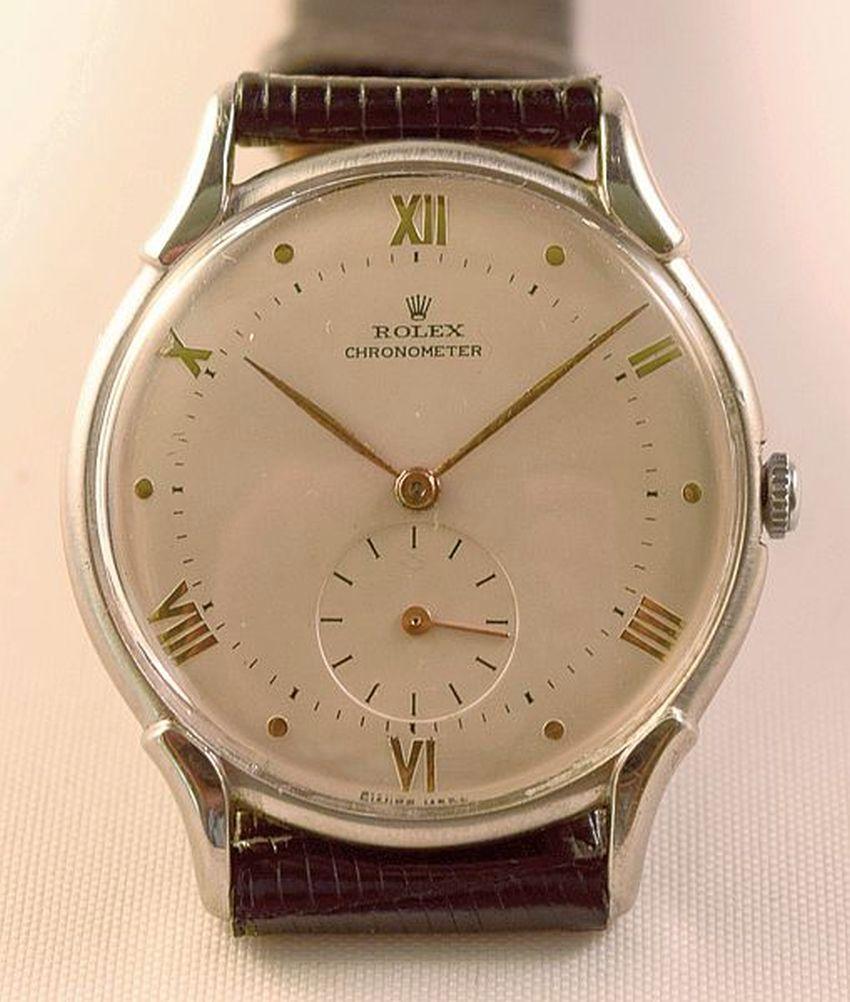 Rolex Ref 4498
Rare rolex chronometer steel case with attractive unusual lugs.
Beautiful dial is with raised gold Roman numerals and dots.
Signed Rolex Chronometer -Rolex Crown-Swiss Made
Gold hands and sub second at six.
Case is unpolished and have