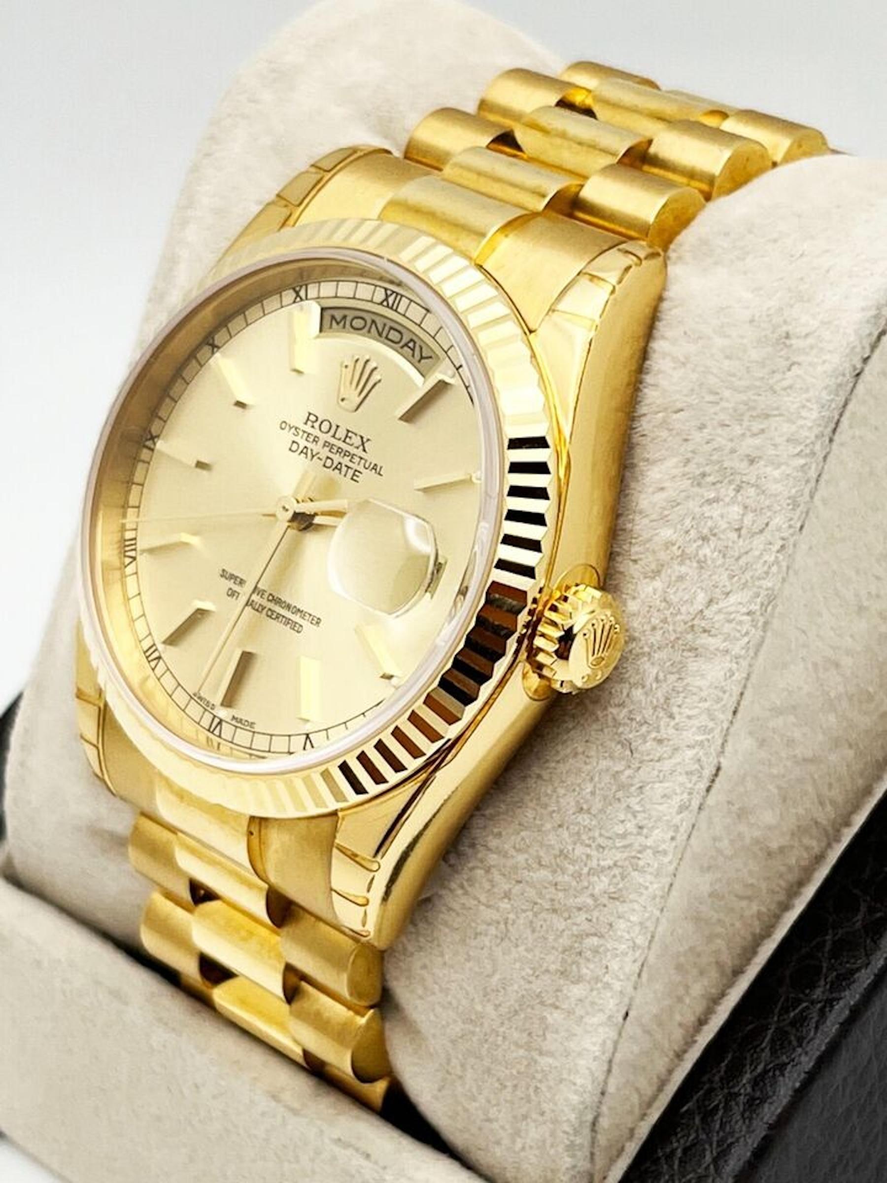 Style Number: 118238. New style buckle With Factory Stickers 

Serial: F626***

Year: 2005 

Model: President Day Date  

Case Material: 18K Yellow Gold 

Band: 18K Yellow Gold 
 
Bezel: 18K Yellow Gold 

Dial: Champagne 

Face: Sapphire Crystal