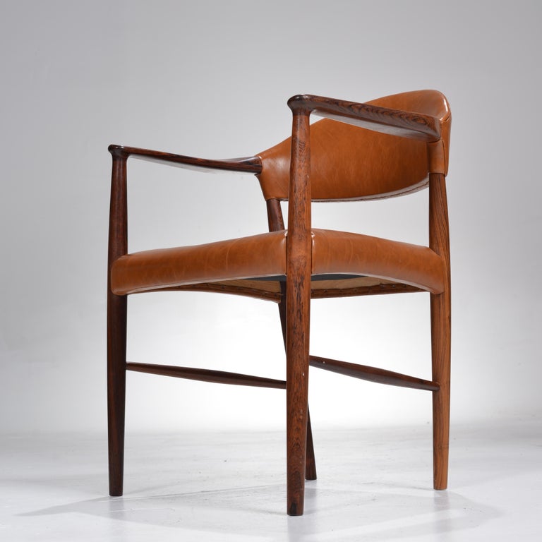 These are rare rosewood armchairs by Enjer Larsen and Aksel Bender Madsen for Larsen + Madsen, c1955. Fully restored in beautiful Italian leather. Allow 3-4 weeks if upholstery service is desired. Priced per chair. 
On display at our Los Angeles