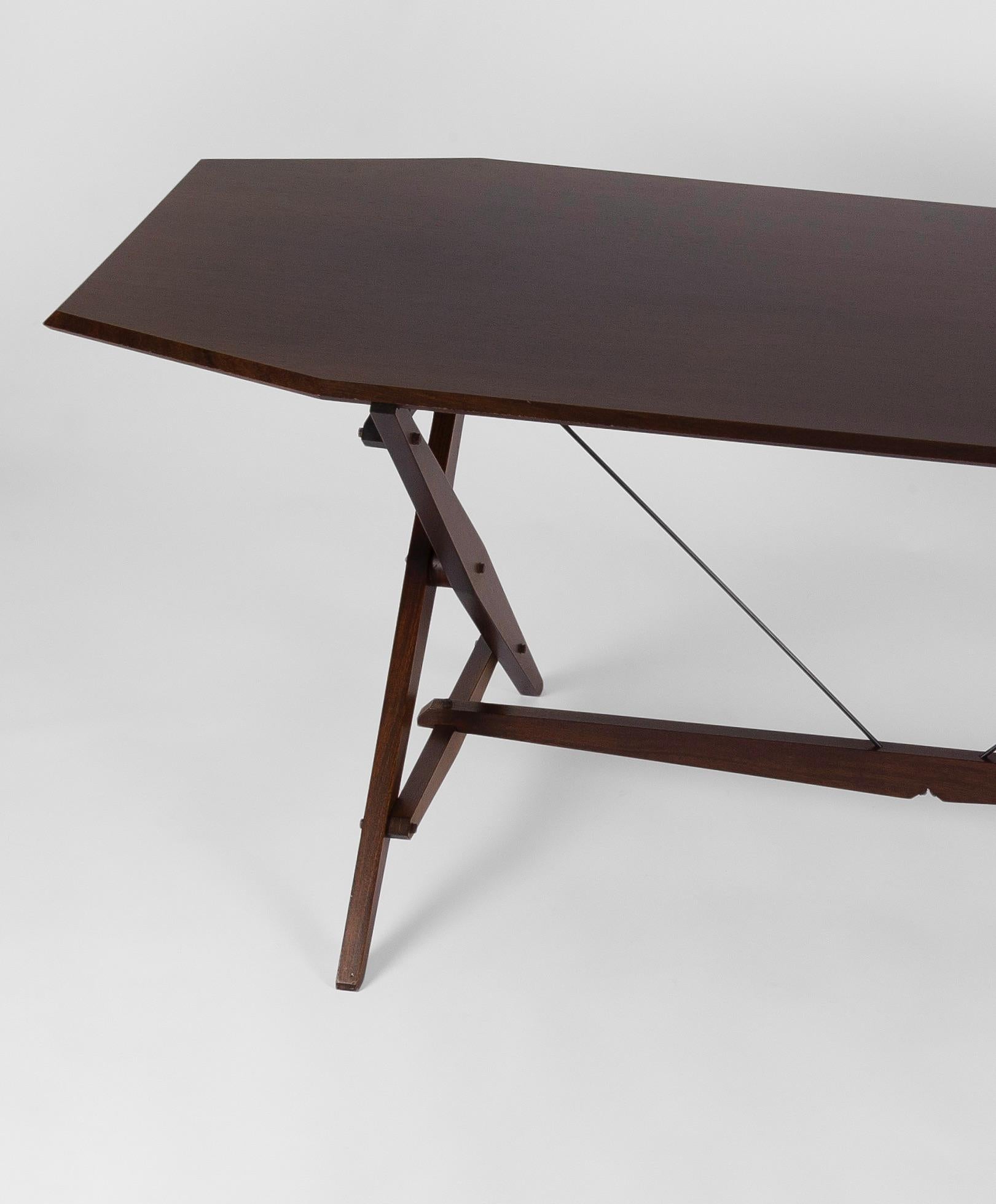 A rare mahogany version of the Cavaletto or TL2 table designed by the great neo-rationalist designer, Franco Albini. Designed in 1950 for manufacturers Poggi, the Cavaletto, (trestle), functions as both part table, part desk, with its beautifully