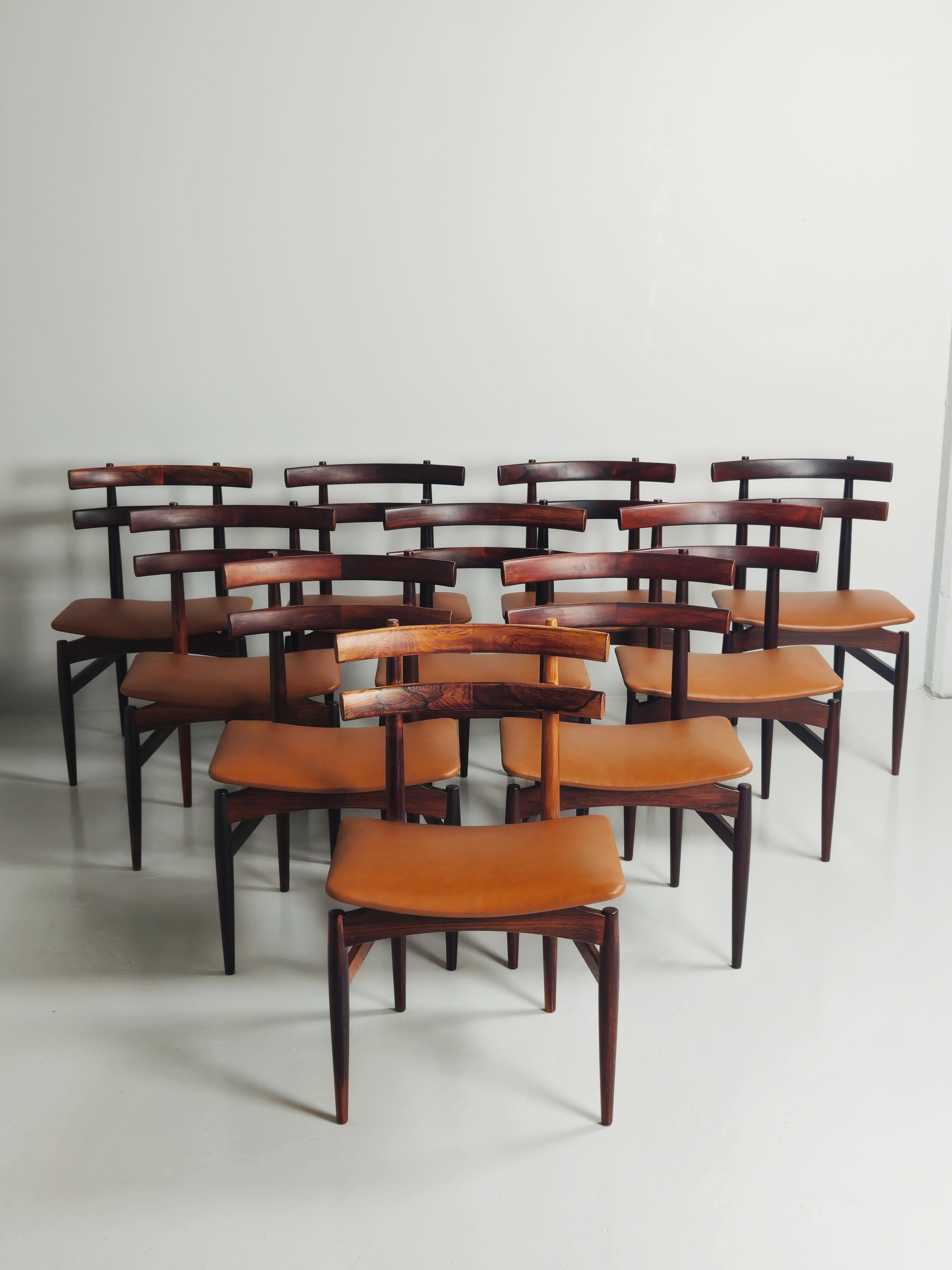 Very rare dining chair designed by Poul Hundevad in Denmark during the 1950s. 

Made in rosewood with seats upholstered in high quality cognac leather.

Eleven chairs available. 