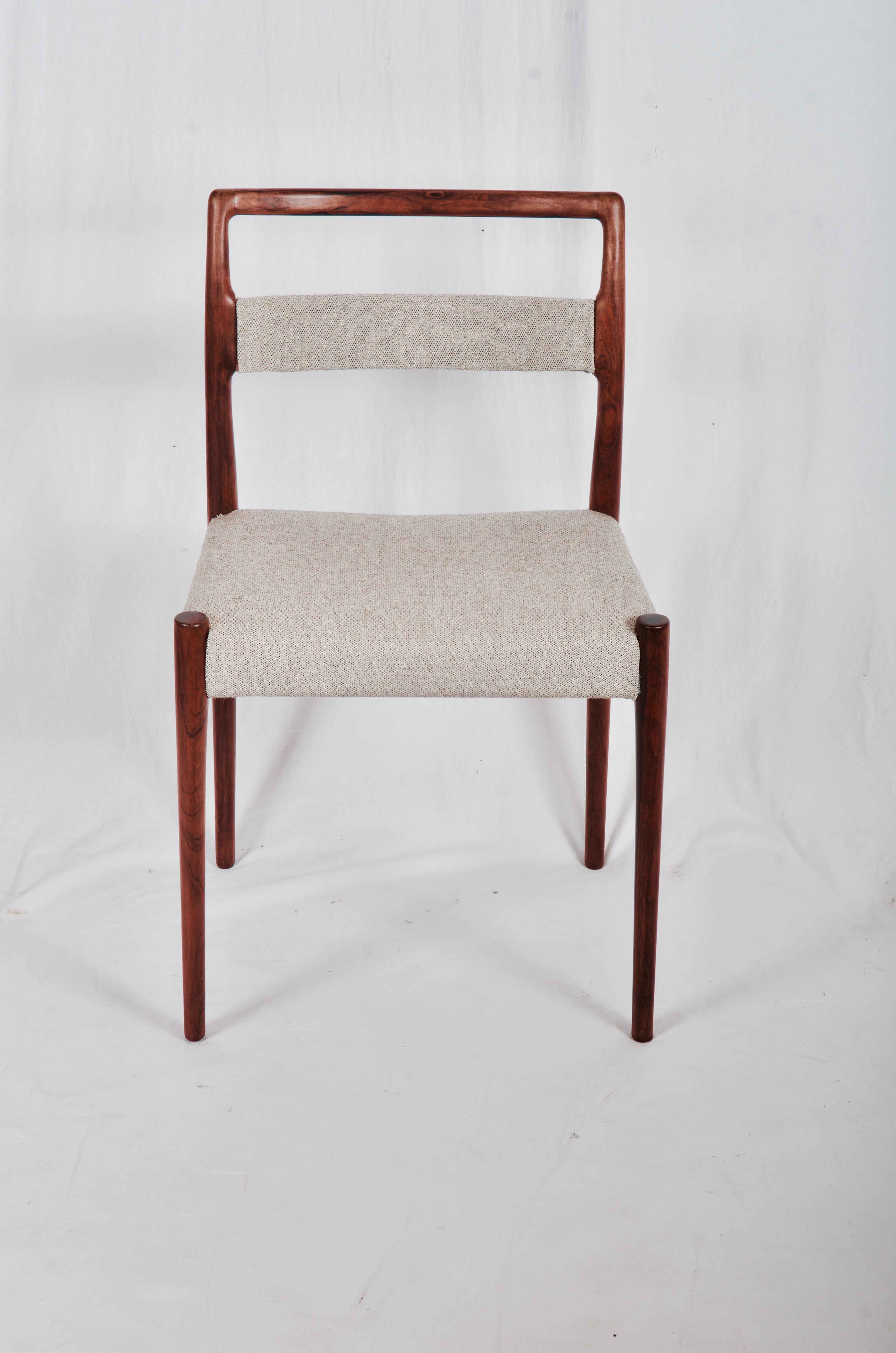 Extremely rare dining chairs, model OD69, designed by Kai Kristiansen and manufactured in Denmark by Oddense Maskinsnedkeri. The chairs are made from solid hardwood, featuring tapered legs, upholstered seat and backrest with Kvadrat fabric. 
Set of