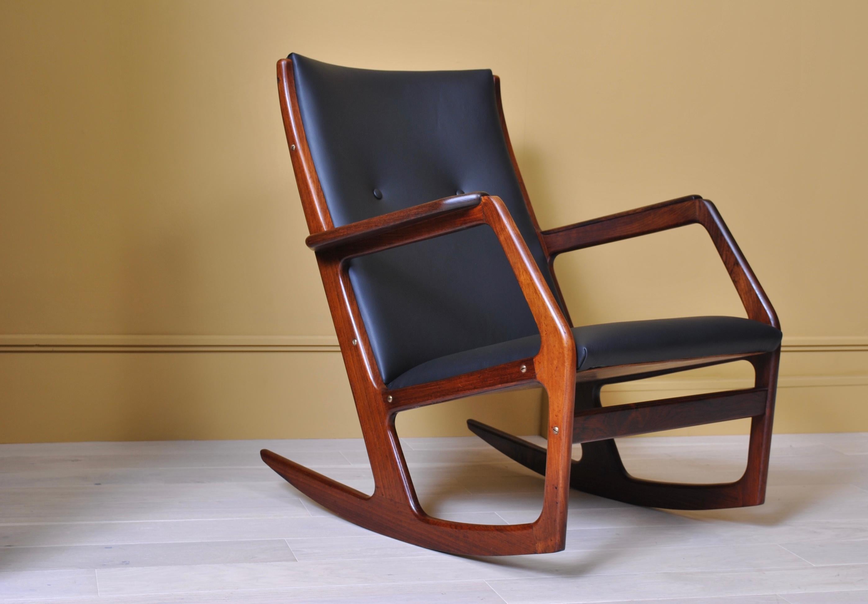 A very rarely seen design by Søren Georg Jensen - particularly in glorious rosewood. This rocking chair has been fully reupholstered to the original specifications in fine black leather. The rosewood frame has been thoroughly cleaned and polished. A