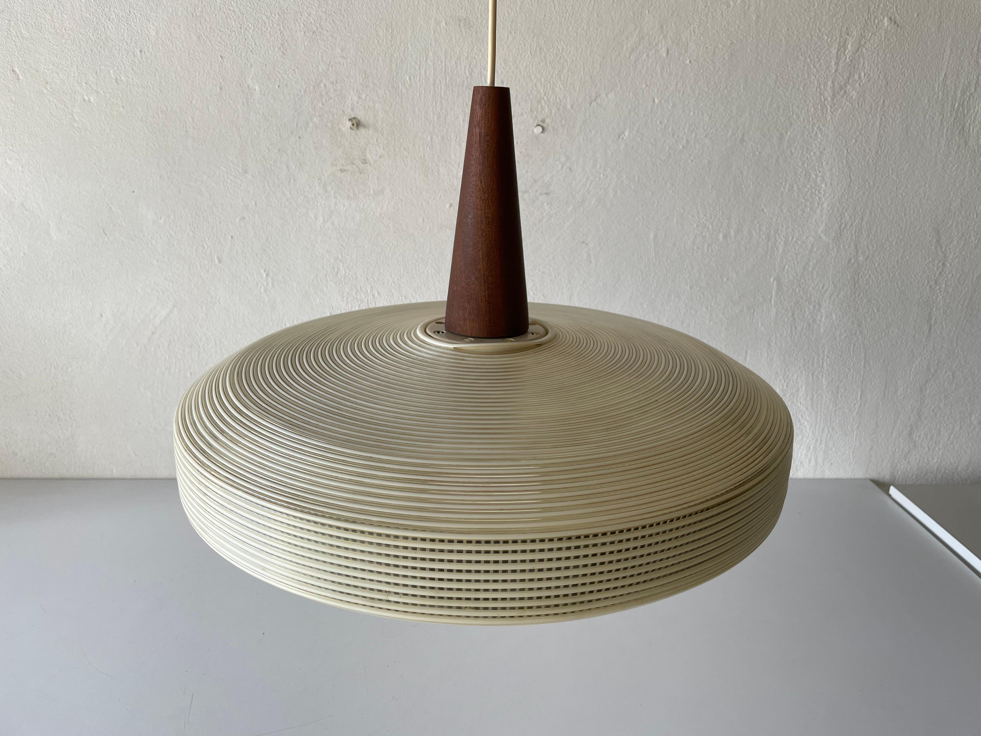 Rare Rotaflex Ceiling Lamp by Yasha Heifetz with Teak Detail, 1960s Germany

Elegant and minimal design hanging lamp

Teak parts and Abs plastic (rotaflex) lampshade
Lampshade is in good condition and very clean. 
This lamp works with E27