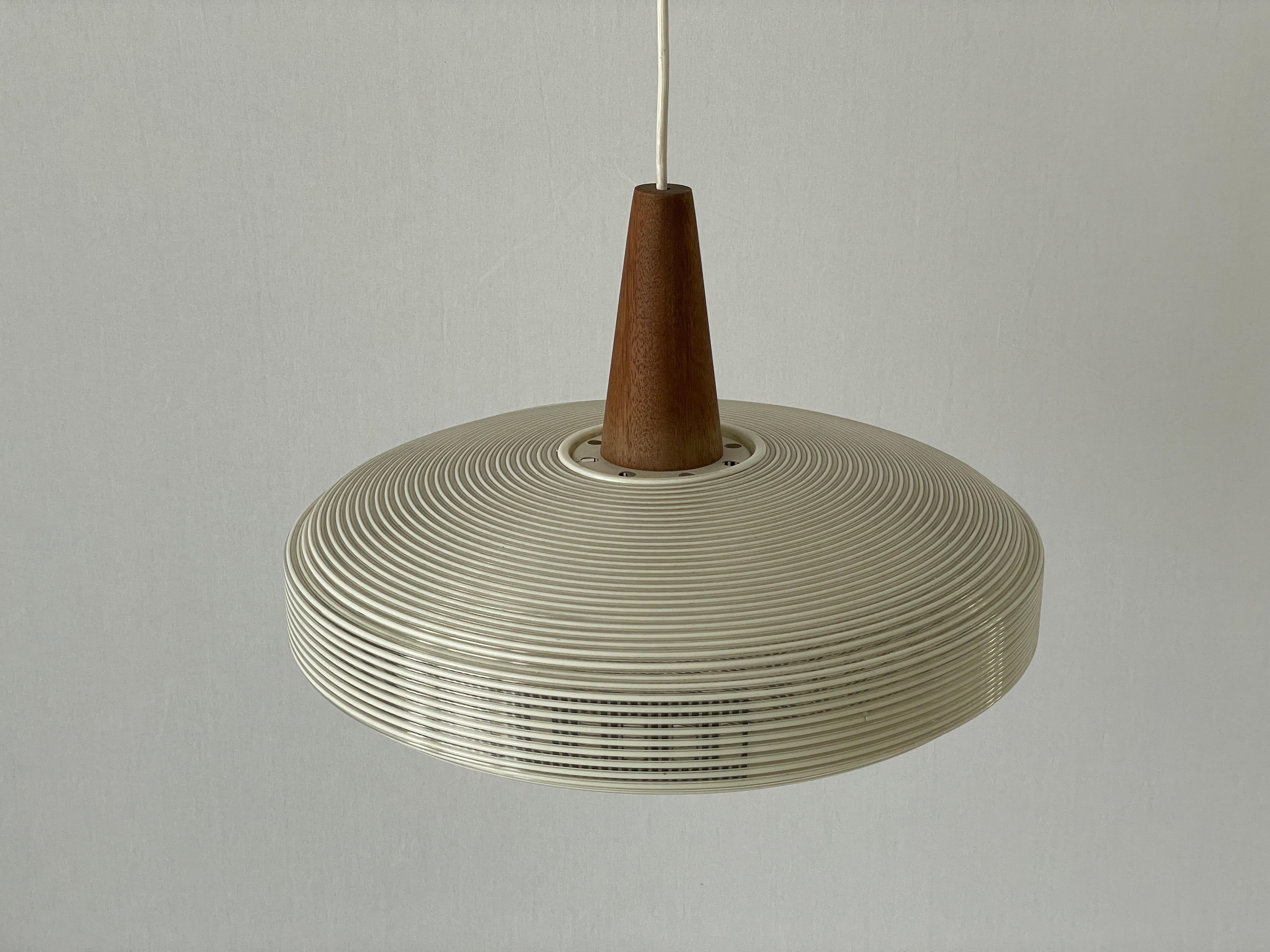 Rare Rotaflex Ceiling Lamp by Yasha Heifetz with Teak Detail, 1960s Germany

Elegant and minimal design hanging lamp

Teak parts and Abs plastic (rotaflex) lampshade
Lampshade is in good condition and very clean. 
This lamp works with E27 light