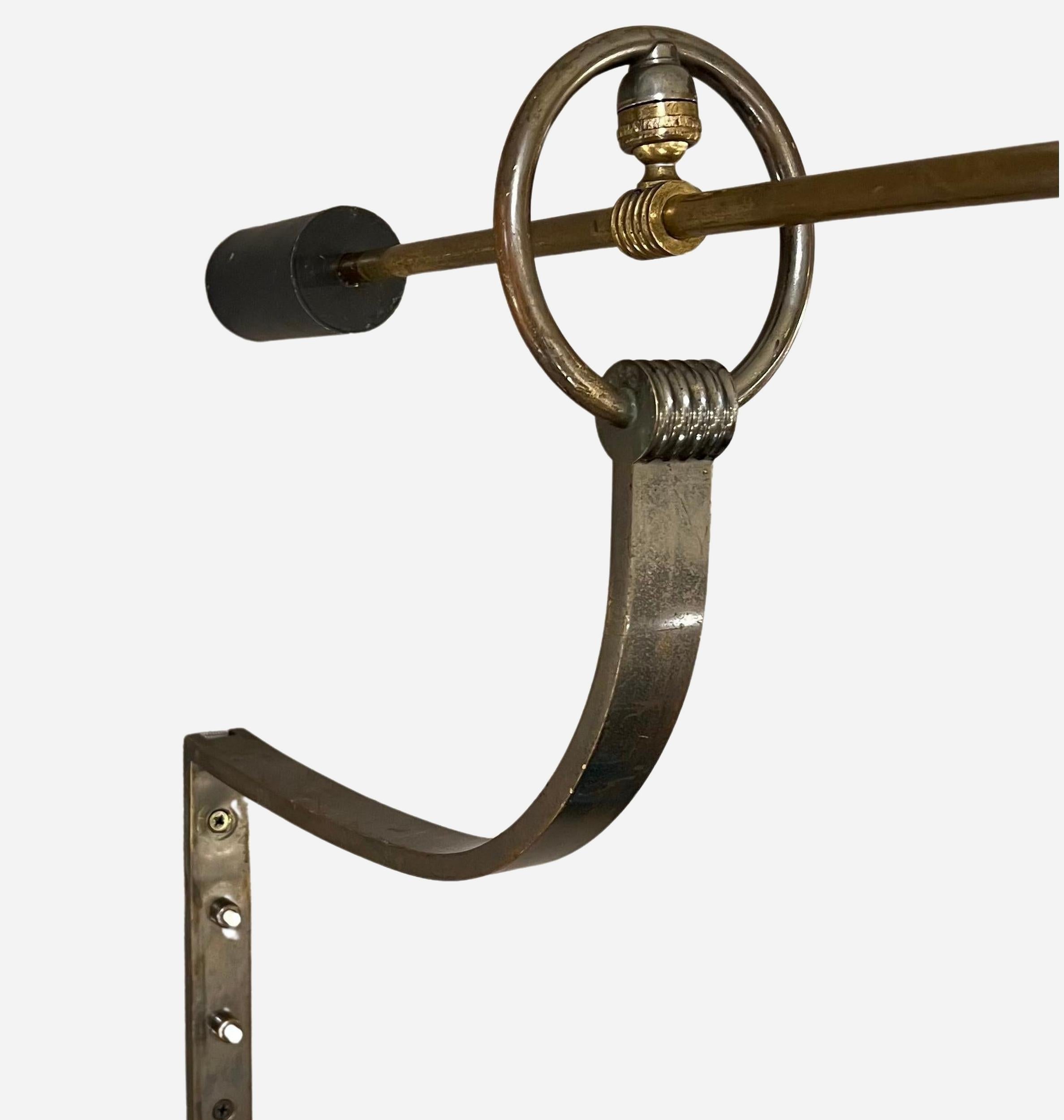 Patinated Rare rotating wall lamp by Maison Lunel, France 1950 For Sale