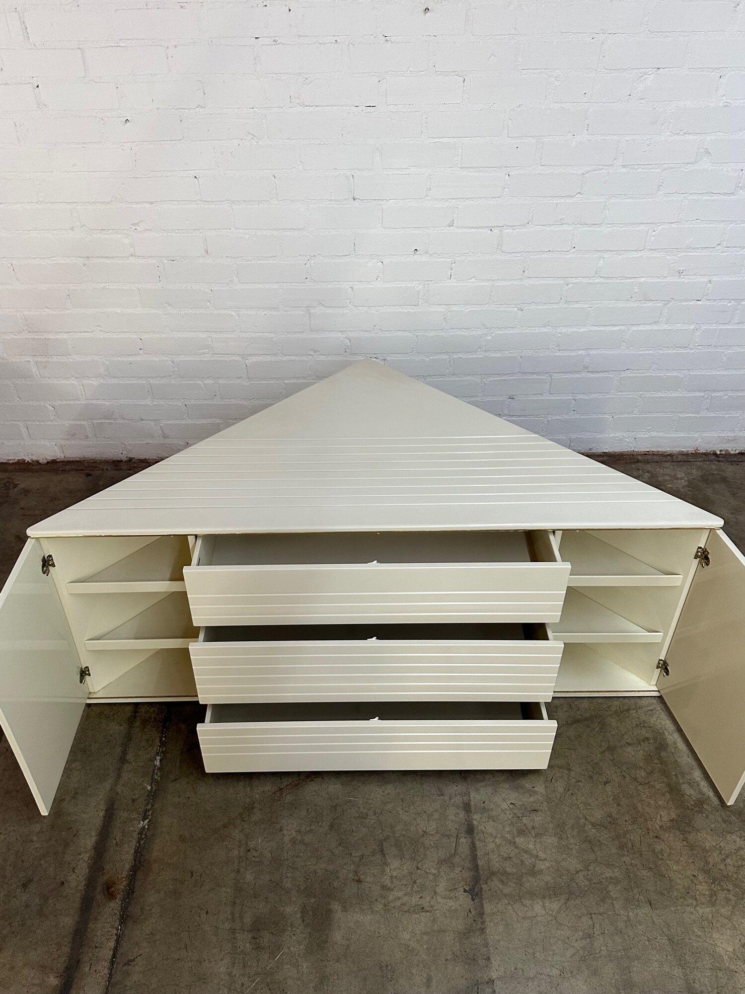 W72 D37 H28.5

Vintage white lacquered dresser and pedestal dual use triangle. Item is fully functional and structurally sound. Item has the original finish with very minor wear and overall very well preserved. Push open drawers drawers reveal both