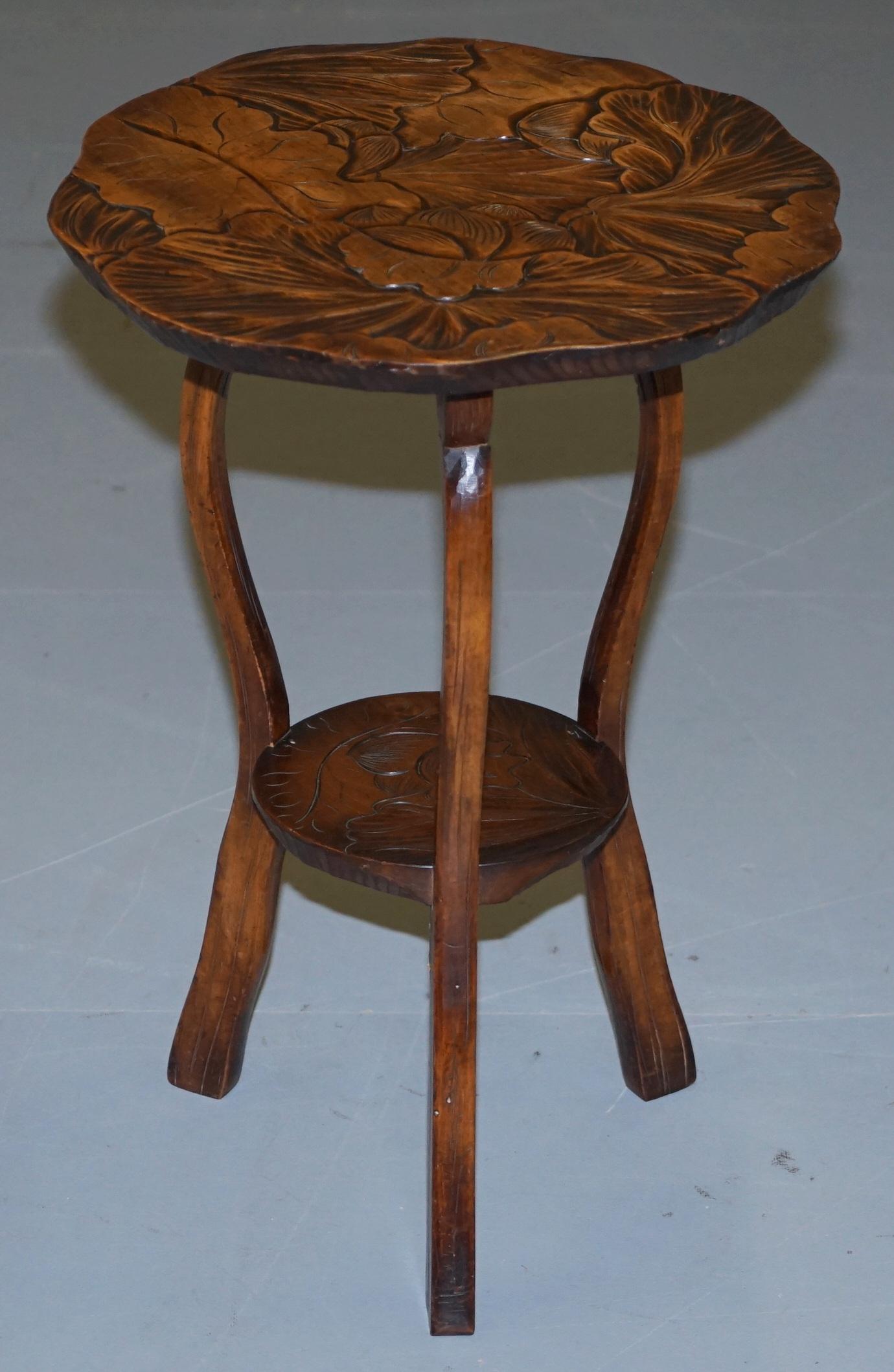 We are delighted to this lovely rare round Liberty’s London 1905 Japanese mahogany side table

A good looking piece, its hand carved from top to bottom with floral detailing, I have another of these shorter and wider listed under my other