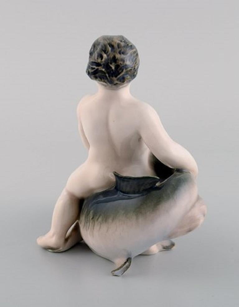 Danish Rare Royal Copenhagen Porcelain Figurine, Boy Sitting on a Fish, 1920s