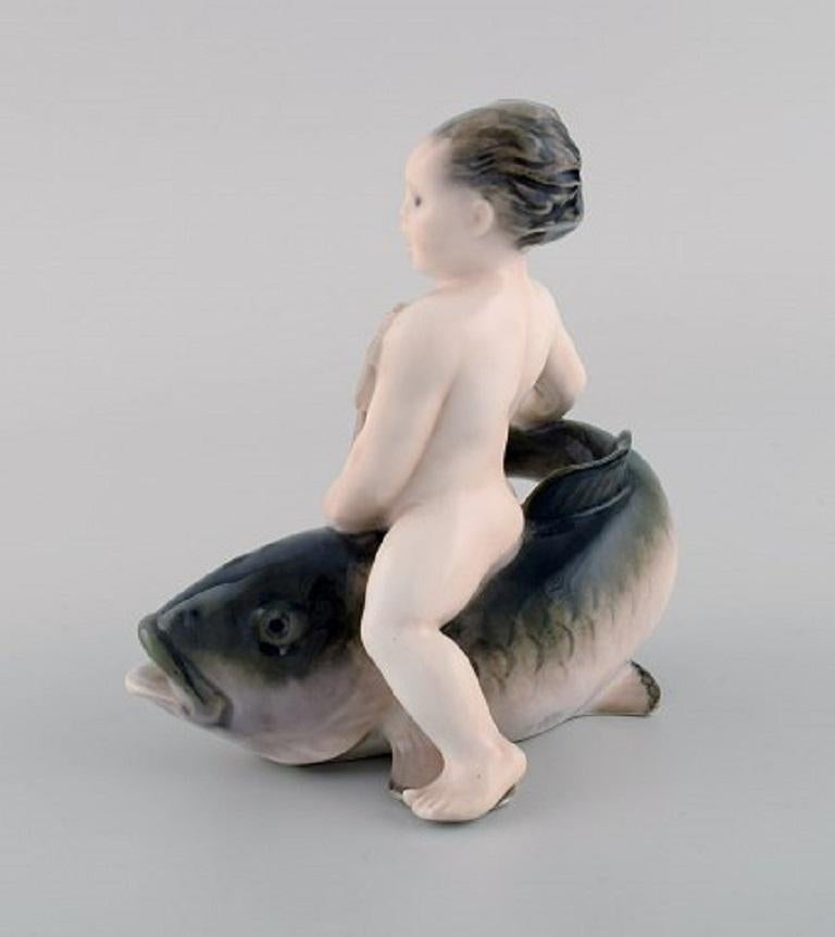Early 20th Century Rare Royal Copenhagen Porcelain Figurine, Boy Sitting on a Fish, 1920s