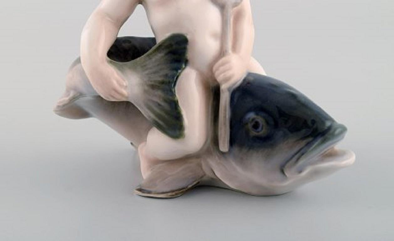 Rare Royal Copenhagen Porcelain Figurine, Boy Sitting on a Fish, 1920s 1