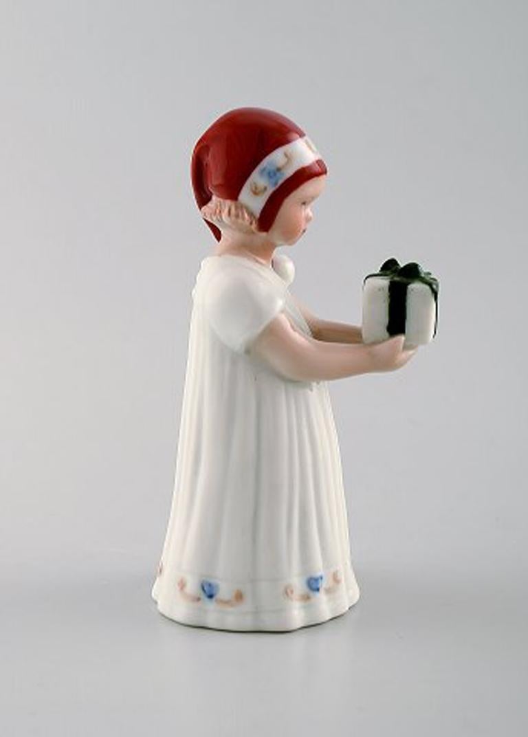 Scandinavian Modern Rare Royal Copenhagen Porcelain Figurine, Girl with Christmas Present