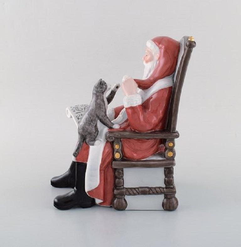 Rare Royal Copenhagen porcelain figurine. Santa Claus with cat. Model number 321.
In perfect condition. 1st factory quality.
Measures: 22 x 19 cm.
Stamped.

 