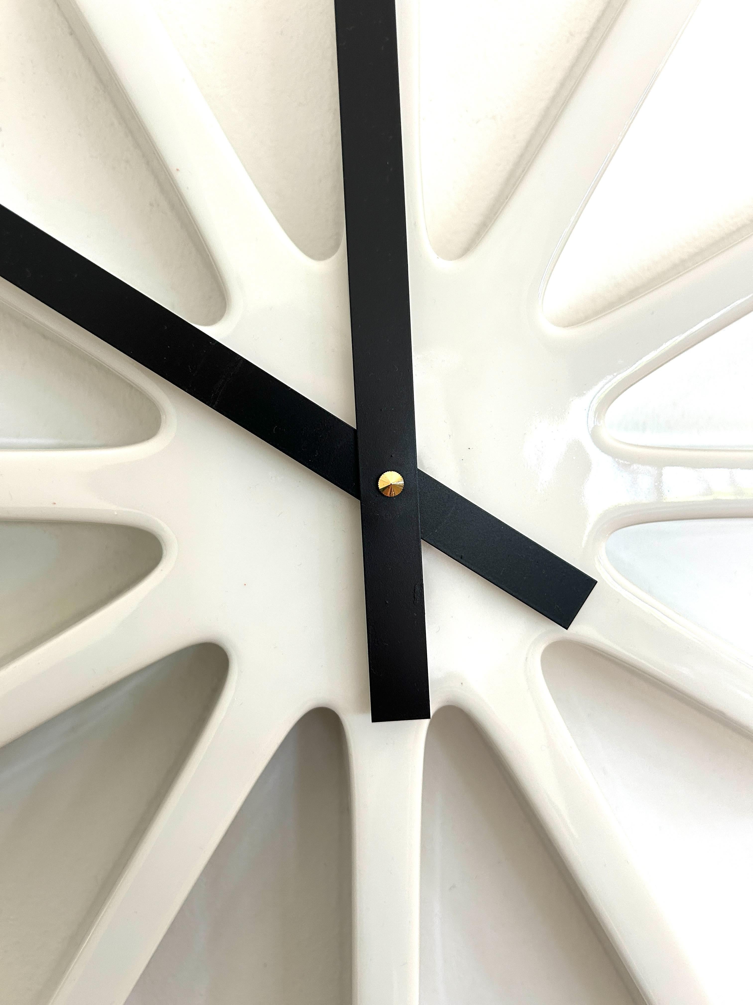 Scarce and sculptural space age wall clock designed by Danish artist Poul Pedersen for Royal Copenhagen, model no. 5151.
This star-shaped clock was approved for production on August 27, 1974 and manufactured in limited numbers around 1976. Executed