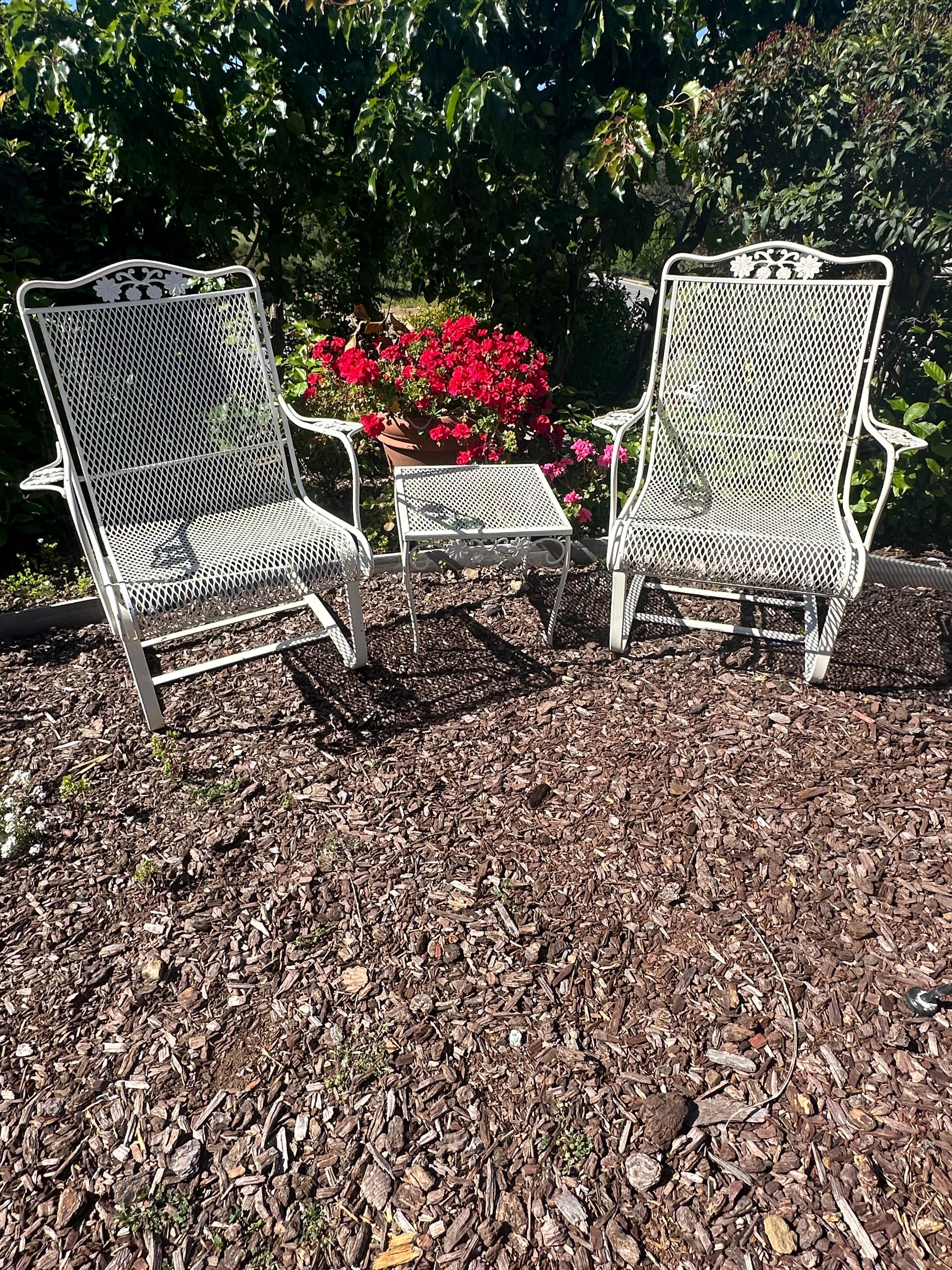 A beautiful set of rocking armchairs with matching side table.
Salterini collection 
Daisies pattern
Made by Russell Woodard
Circa 1960’s
Made of wrought Iron
chairs in great working condition 
Table is 16”square and 14”height 
No makers label or