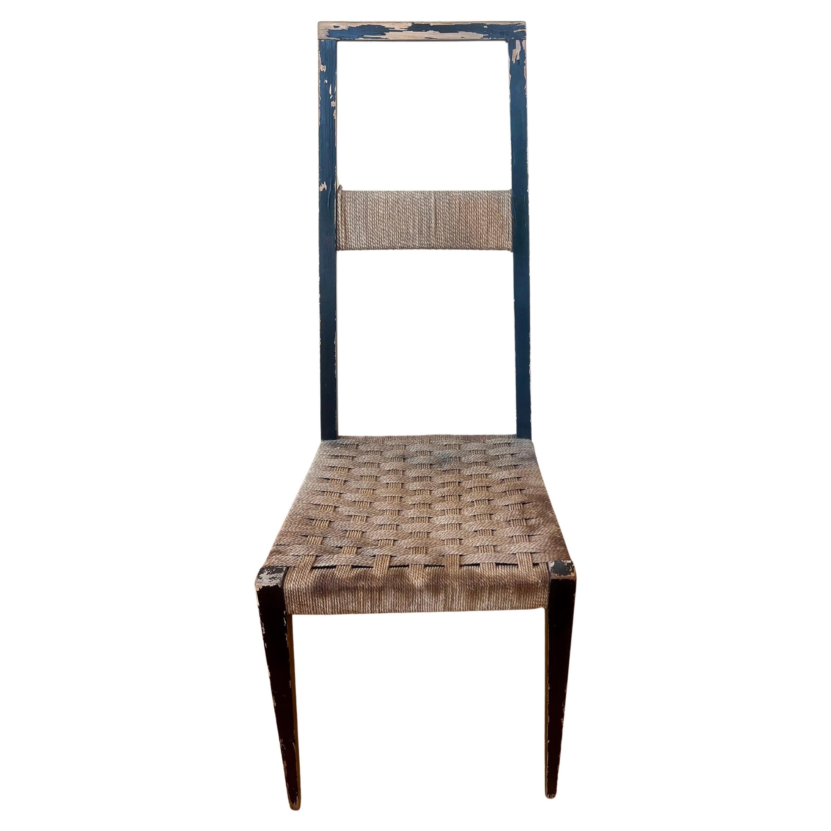 A very rare wood lacquered chair circa 1950's sold as/is condition Made in Italy with cord seats retains made in Italy, retains part of label curved back.
