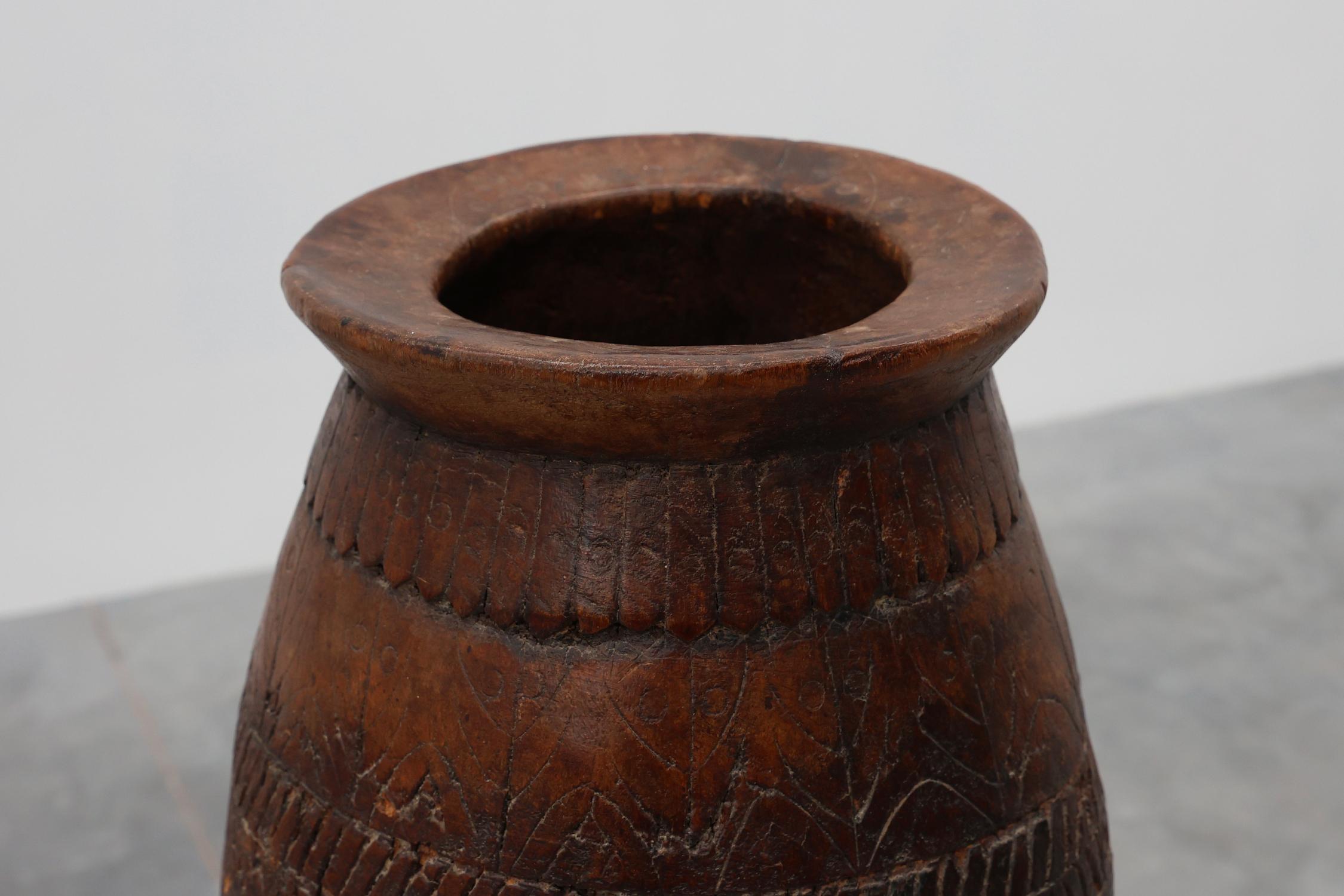 France / 1800 / vase / wood / Rustic / Antique

Handmade French solid wooden vase from the late 18th or early 19th century. This decorative antique piece was crafted from warm dark brown wood and gathered beautiful patina in time. The organic,