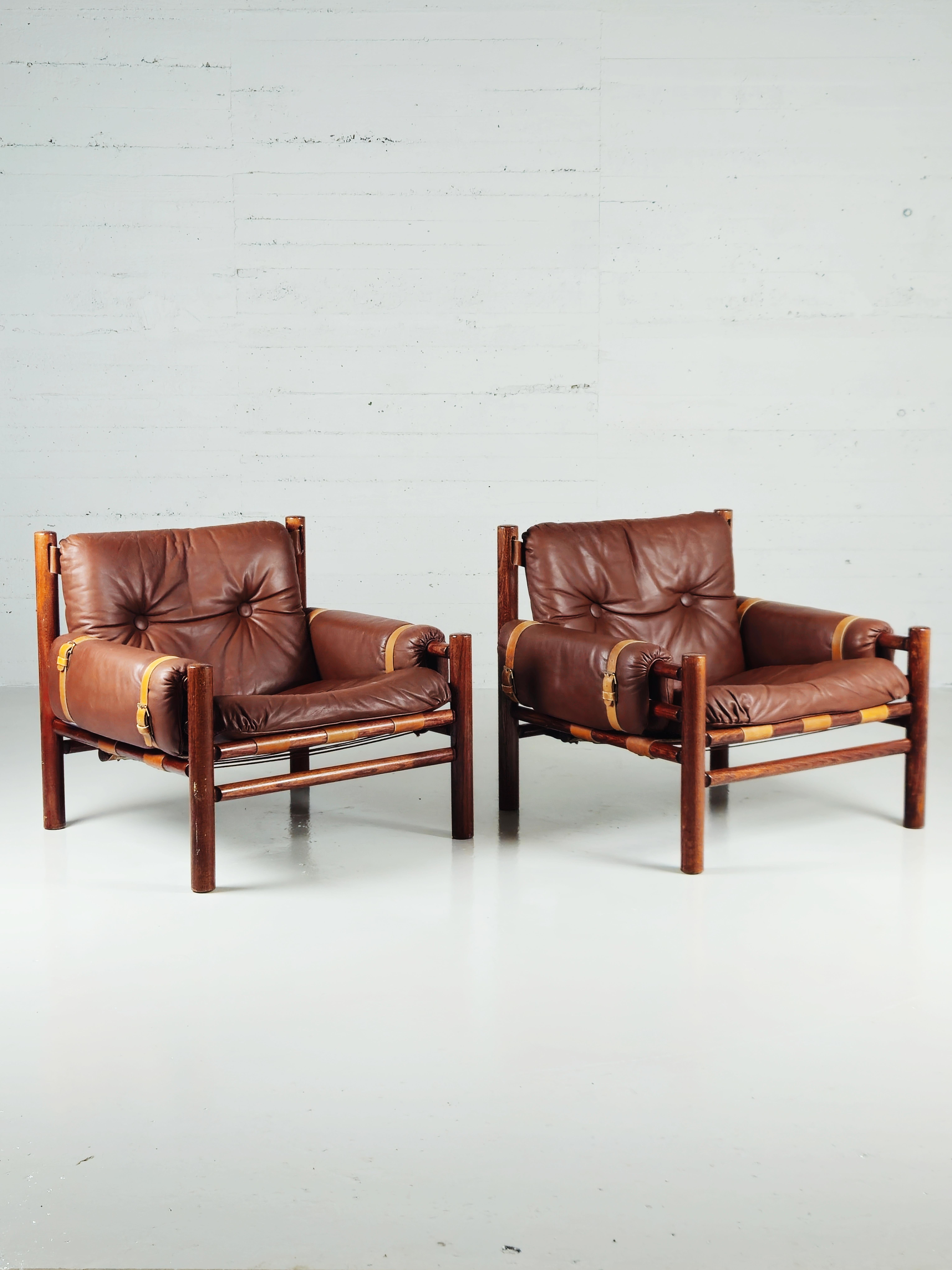 Very rare pair of safari lounge chairs produced by Bruksbo, Norway, during the 1970s. 

Made in beech with brown leather with beautiful details. 

In the style of lounge chairs by Swedish designed Arne Norell. 