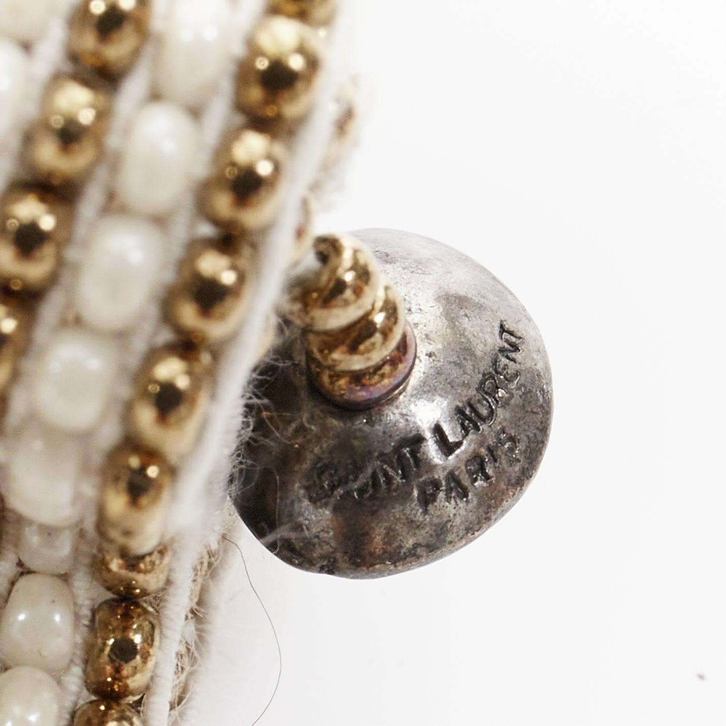 rare SAINT LAURENT Hedi Slimane Hippie Miyuki ethnic bead elastic cuff bracelet
Référence : TGAS/F00508
Marque : Saint Laurent
Designer : Hedi Slimane
Matériau : Plastique
Couleur : ivoire, or
Motif : Ethnique
Fermeture : élastique
Détails